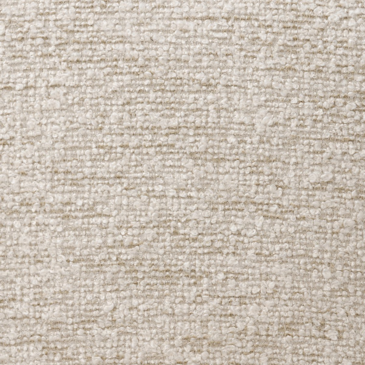Close-up showing the Delfino Arm Chair's ivory boucle upholstery, its nubby, looped texture and soft tonal variation catching the light.