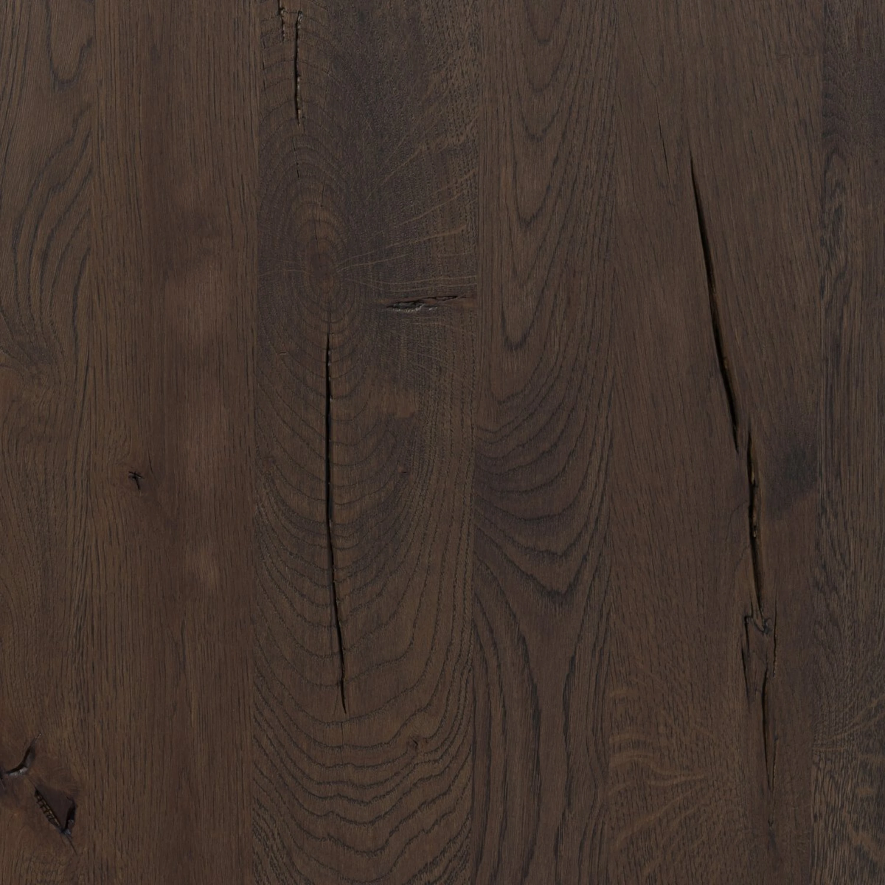 Detail of the Hewitt Sideboard oak surface showing natural knots, cracks and expressive grain characteristic of the wood.