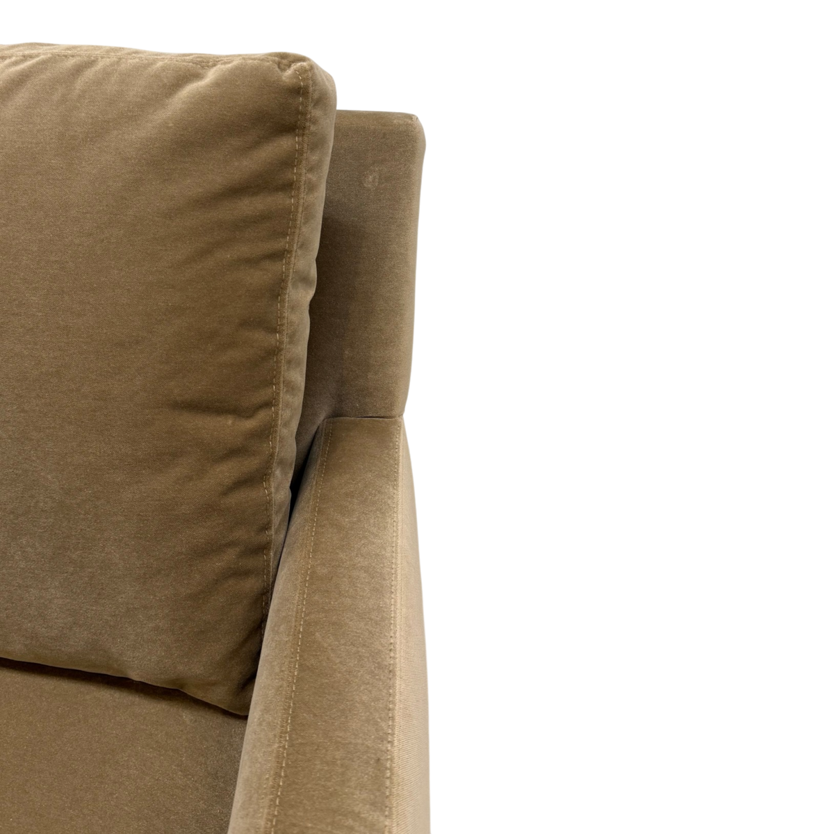 Close-up of the Weston Swivel Chair showing the plush back cushion, slim track arm and soft Winthrop Caramel upholstery.