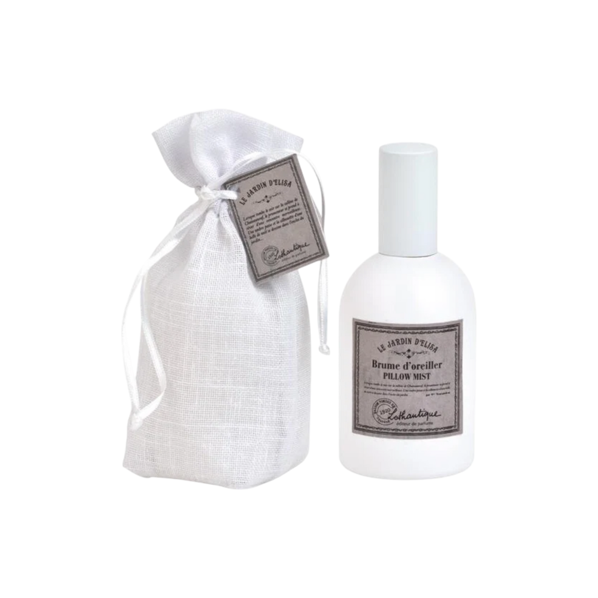 A white bottle of Collette & Marie 'En Rose Pillier' Pillow Mist next to a white linen drawstring pouch with a matching tag, set against a plain white background.