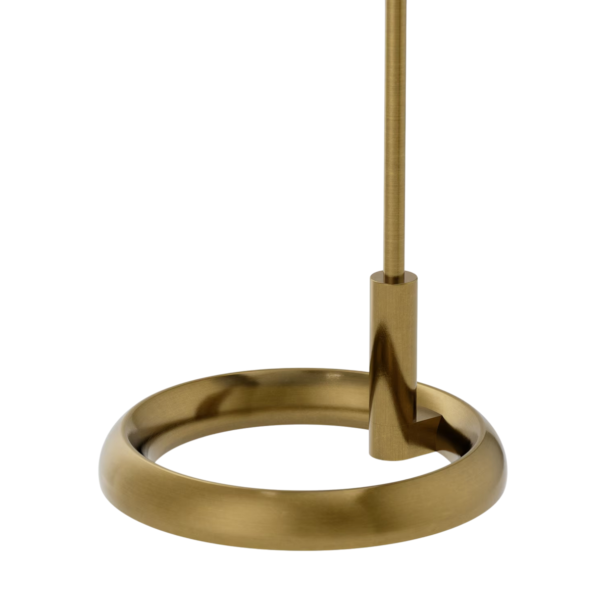 Gable Floor Lamp in antique brass with a circular base, slender stem, and sculptural curved profile designed to support a linen shade.