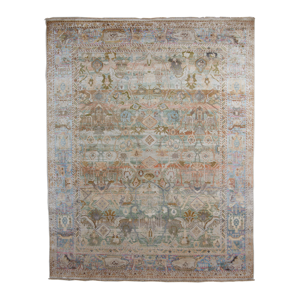 A rectangular vintage-style area rug with an intricate, distressed geometric and floral pattern in muted tones of beige, blue, green, and rust orange, shown flat against a white background.