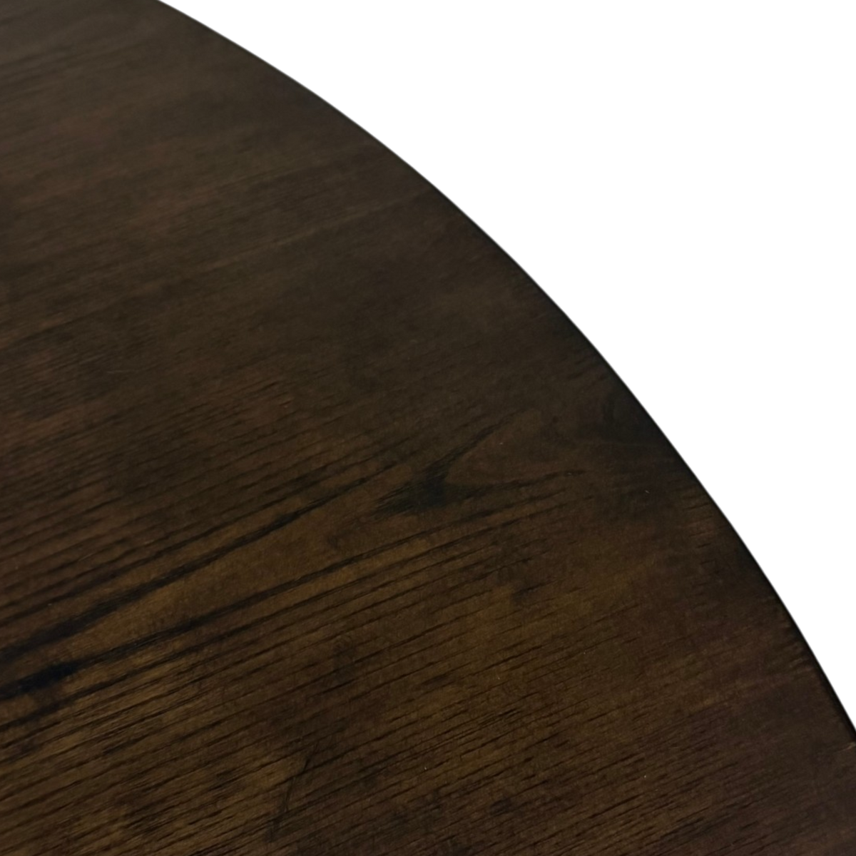 Close-up of the Chino Dining Table smoked ash tabletop showing natural dark brown wood grain and tonal variation.
