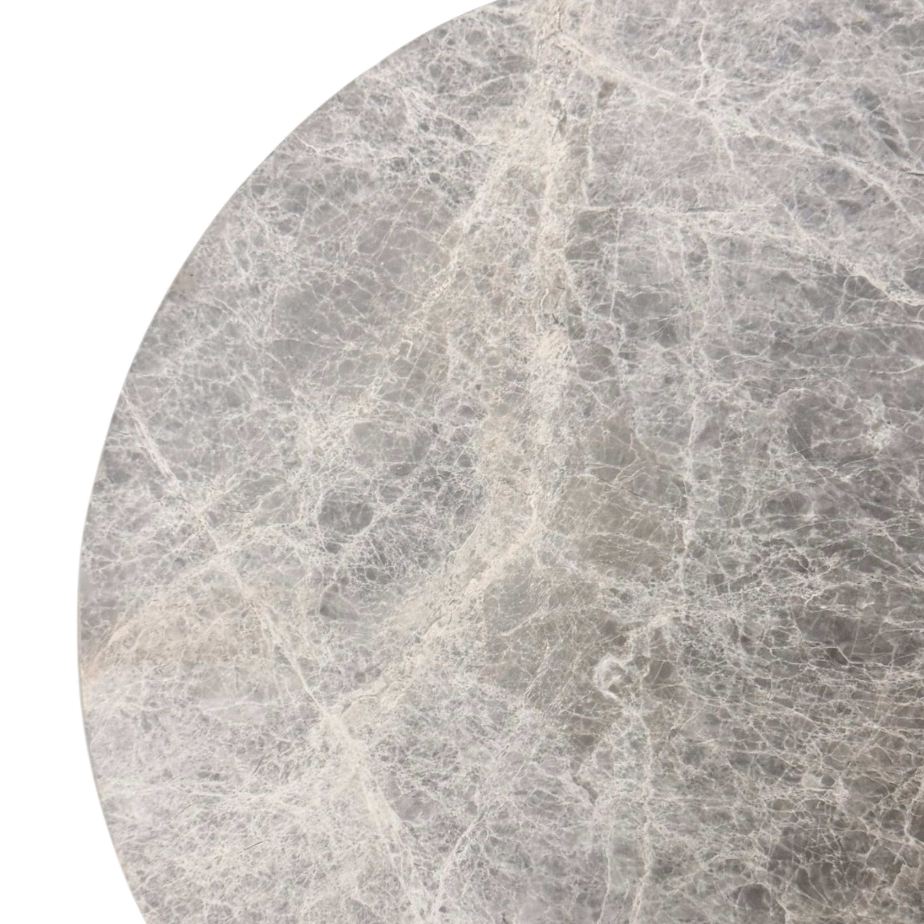 Close-up of the Ward Side Table top, highlighting the curved edge, cool grey stone and dense network of fine white veining.