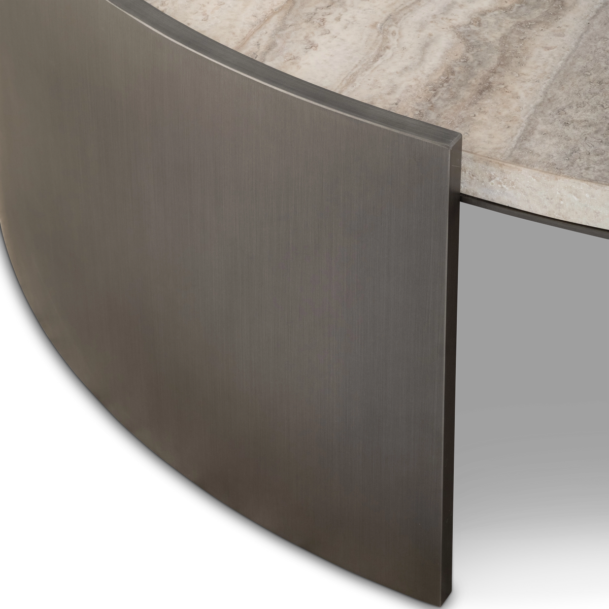 Close-up showing the Beam Coffee Table’s curved Aged Pewter brushed metal panel beside the cream travertine top and its honed stone edge.