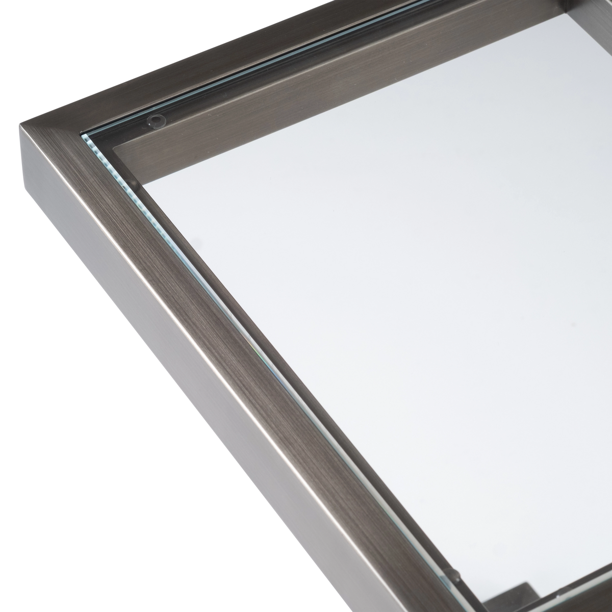 Tenor Pull Up Table shown from the front in Aged Pewter metal with a clear glass top, two slim uprights and a rectangular floor frame.