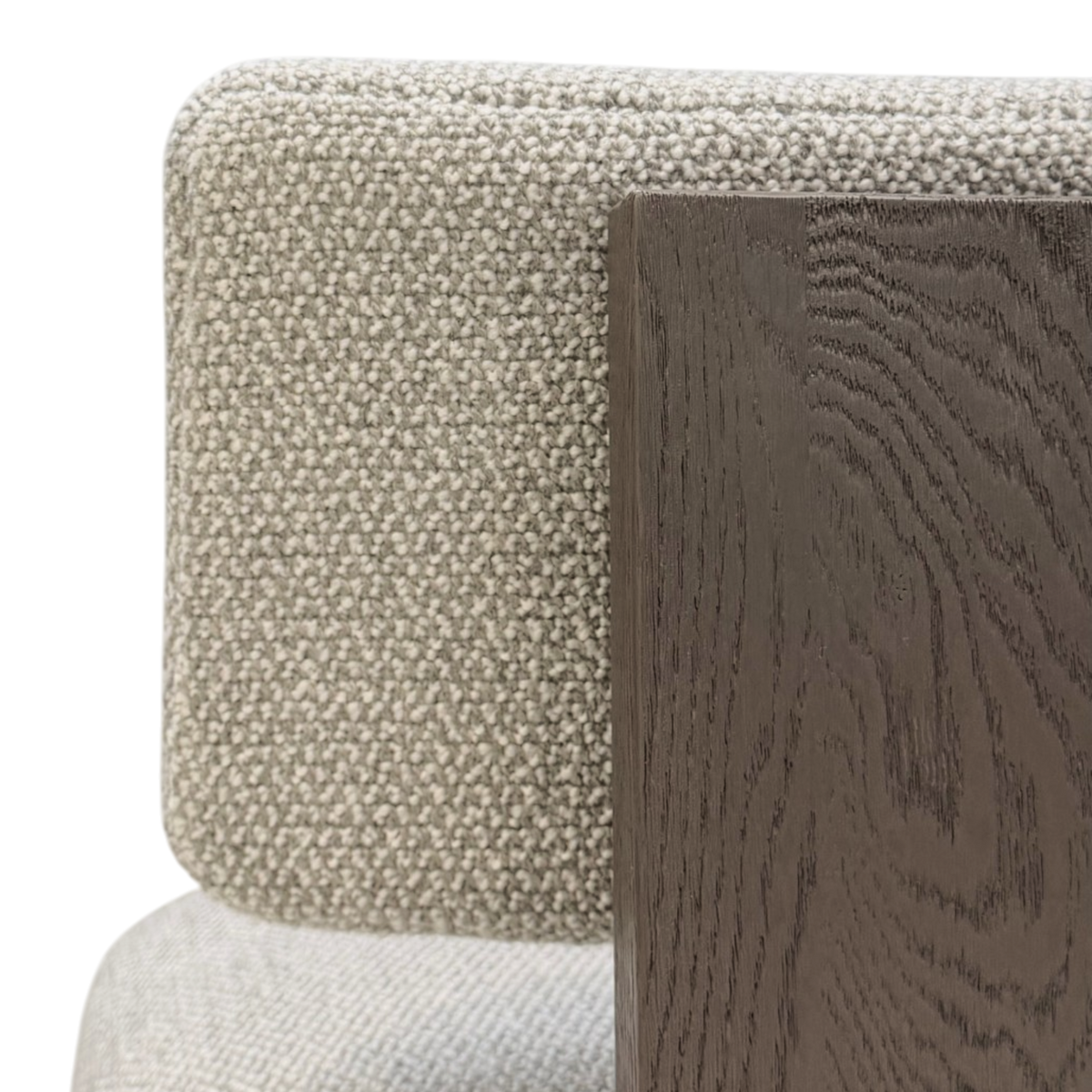 Giussano Dining Chair detail showing ivory bouclé upholstery beside the warm dark wood frame with visible natural grain.