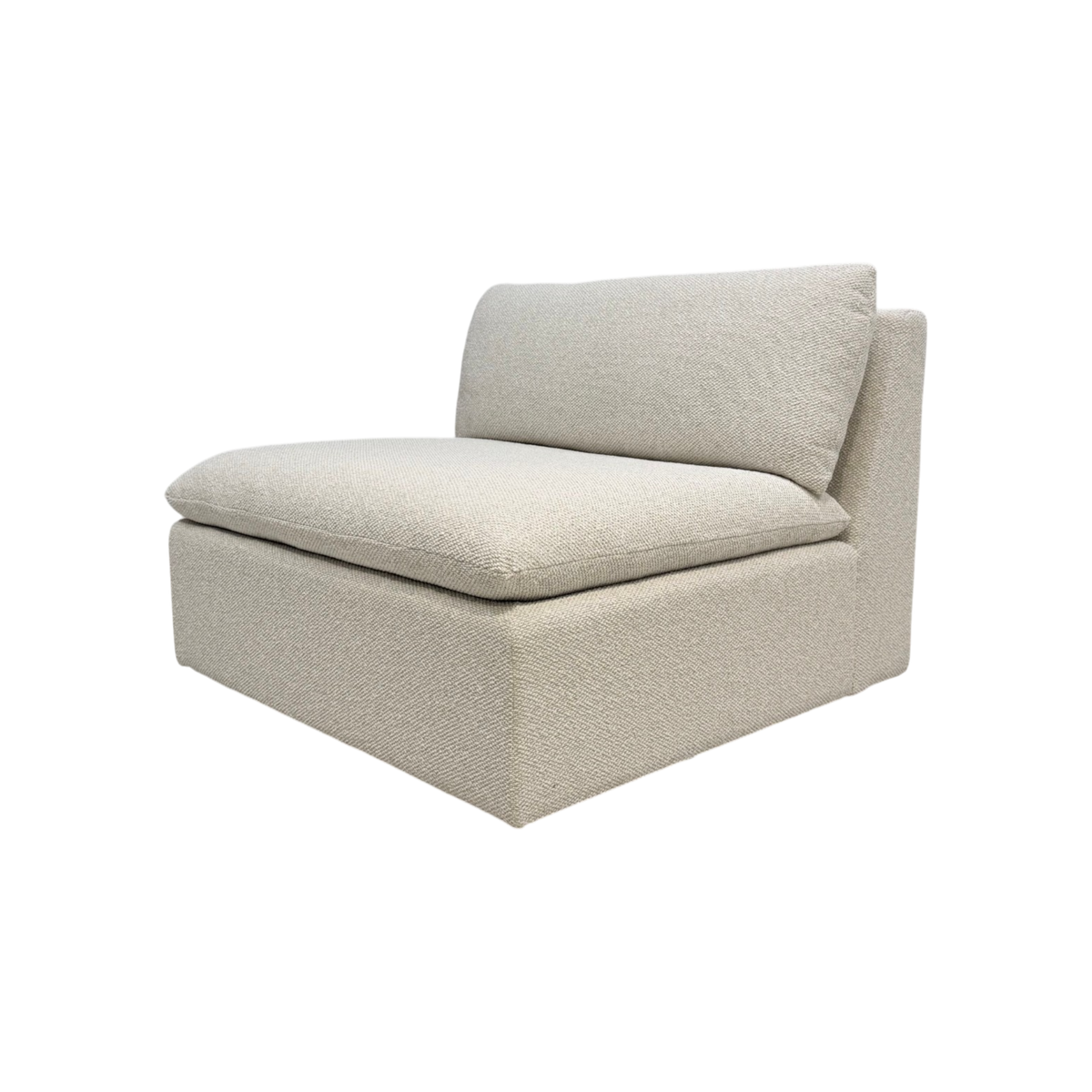 Tempo Modular Armless Chair in a three-quarter view with ivory textured upholstery, a low profile, and generously scaled loose cushions.