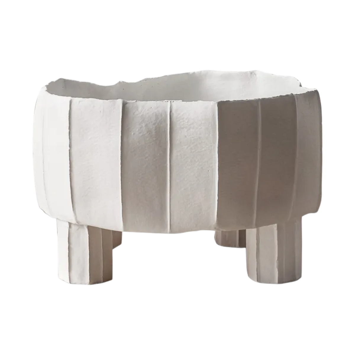 Tripode Bowl in soft white paper clay with sculptural paneled sides, an irregular rim and three rounded pedestal feet.