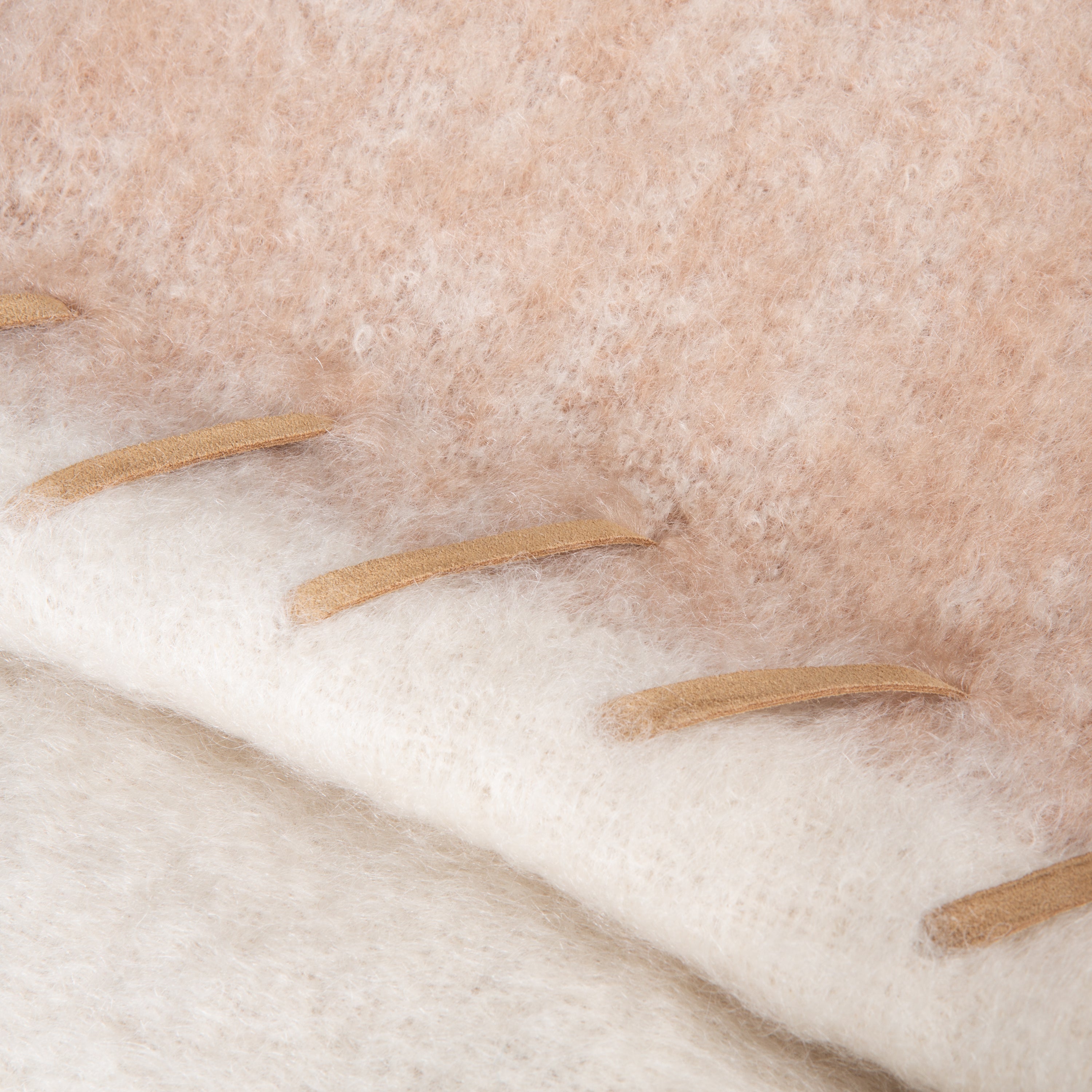 Using natural mohair from Angora goats, which is known for its soft, silky texture, the Mohair Stitched Throw is characterised by its fluffy, thin fibres that provides exceptional