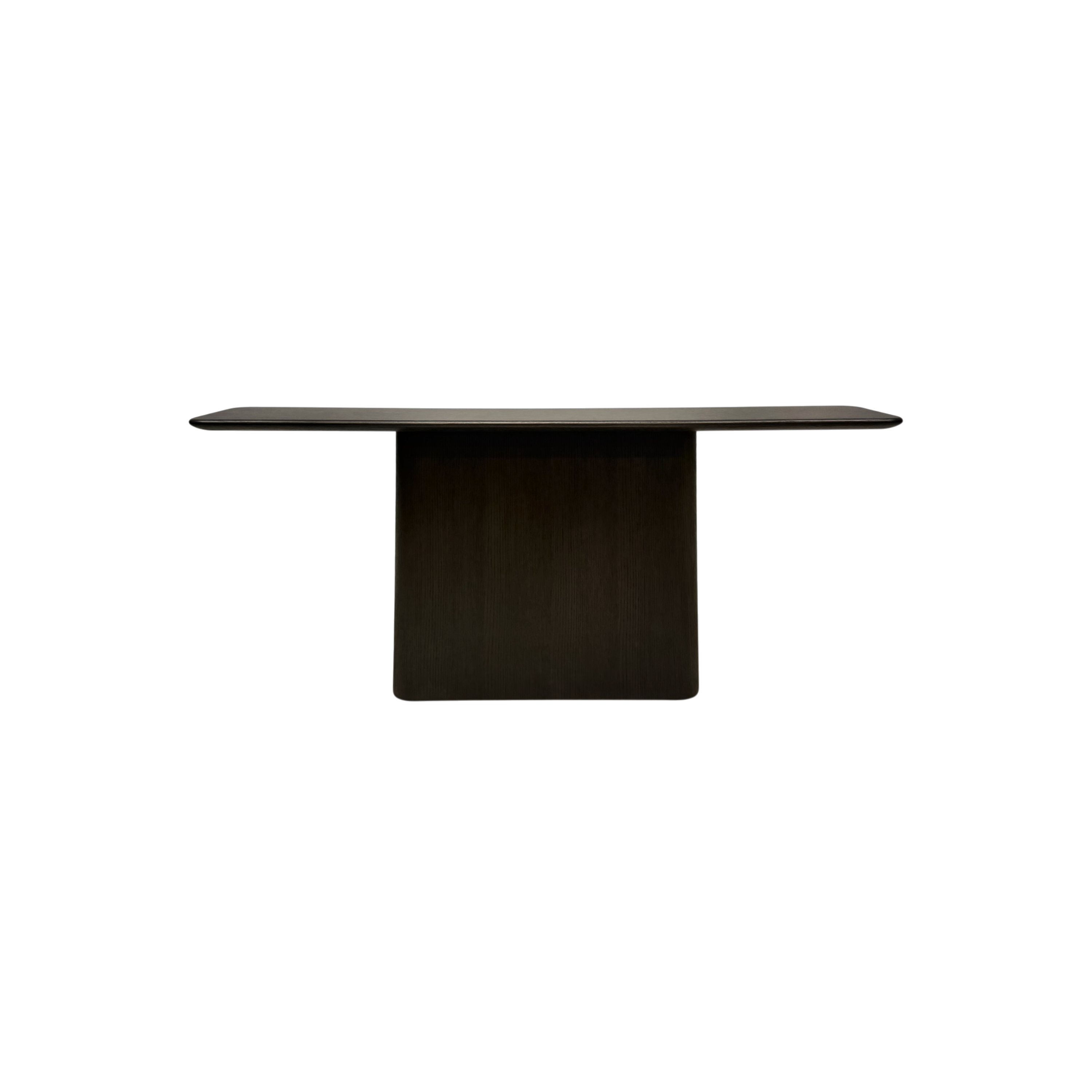 A modern dark wood pedestal table with a rectangular top and a single central column base, shown against a plain white background.