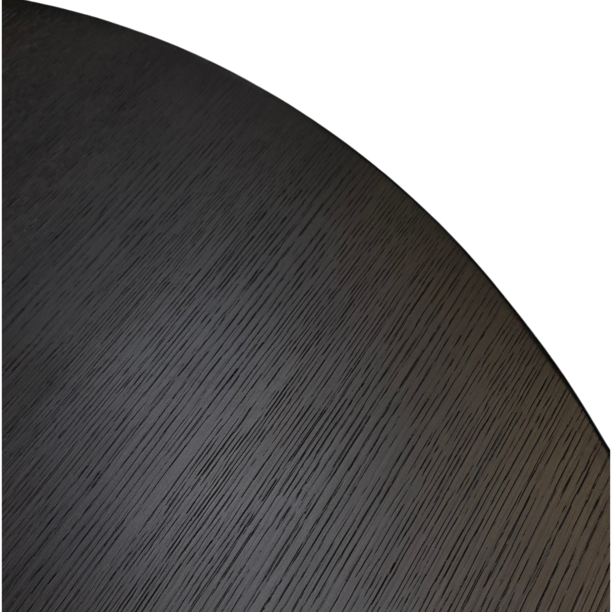 Detail of dark brown oak grain across the round tabletop of the Altar Dining Table.