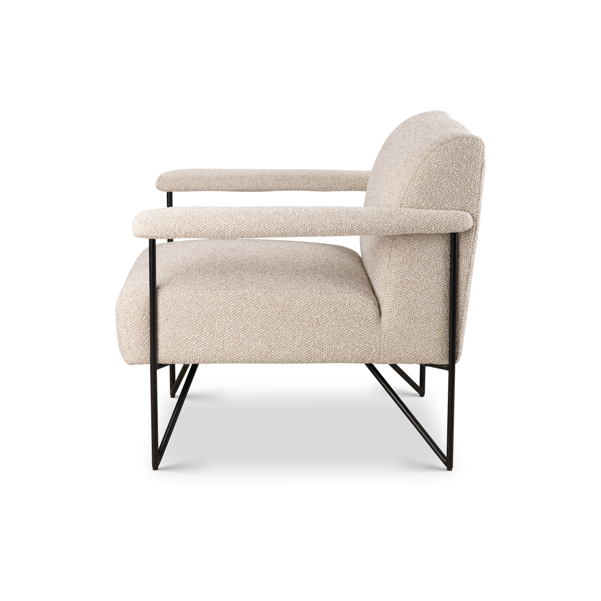Knox Lounge Chair shown from the side in oatmeal fabric, with long padded arms, a gently angled back, and a black tubular frame with sled-style feet.