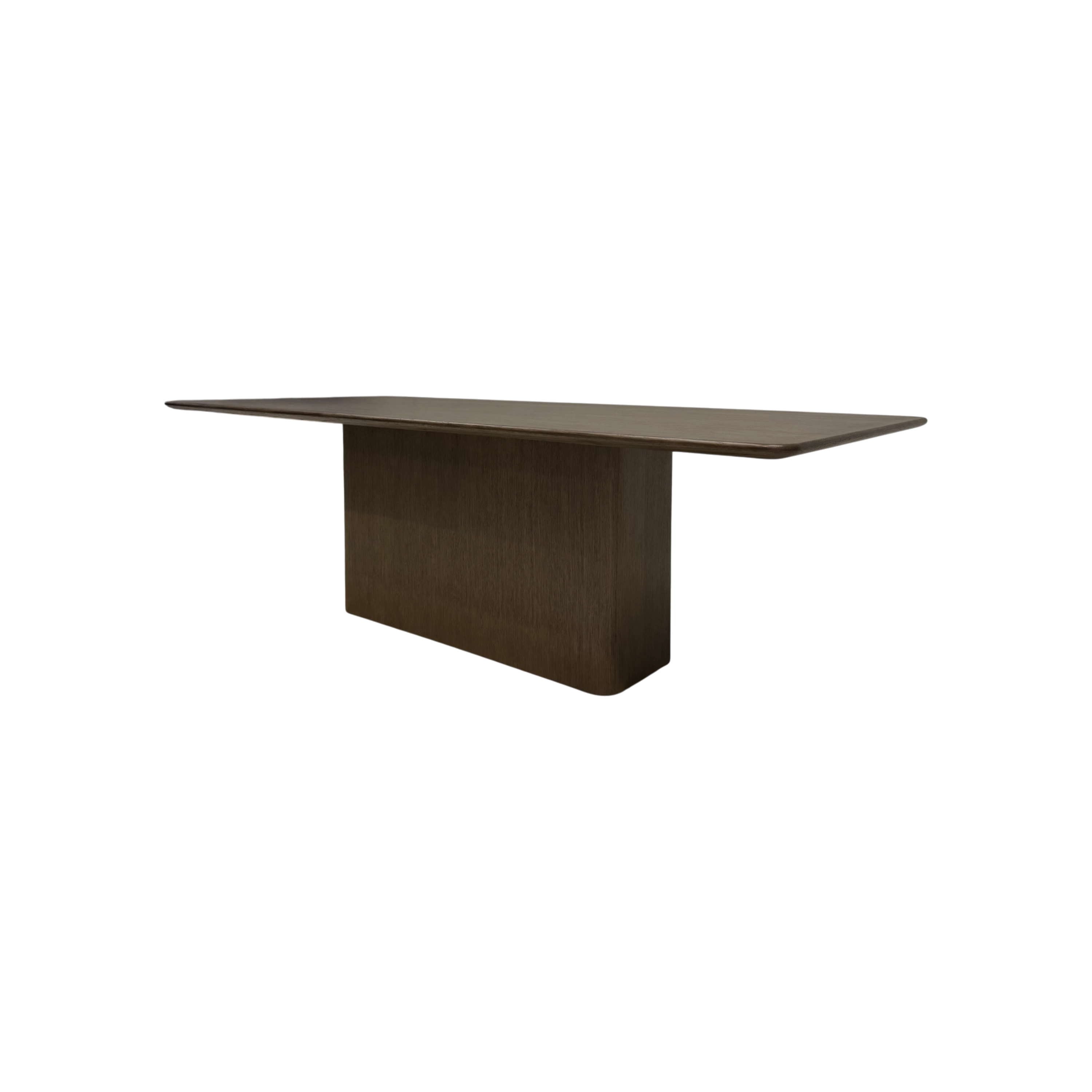 Angled view of the Altar 96-inch Dining Table showing its elongated wood top, gently softened corners and architectural pedestal base.
