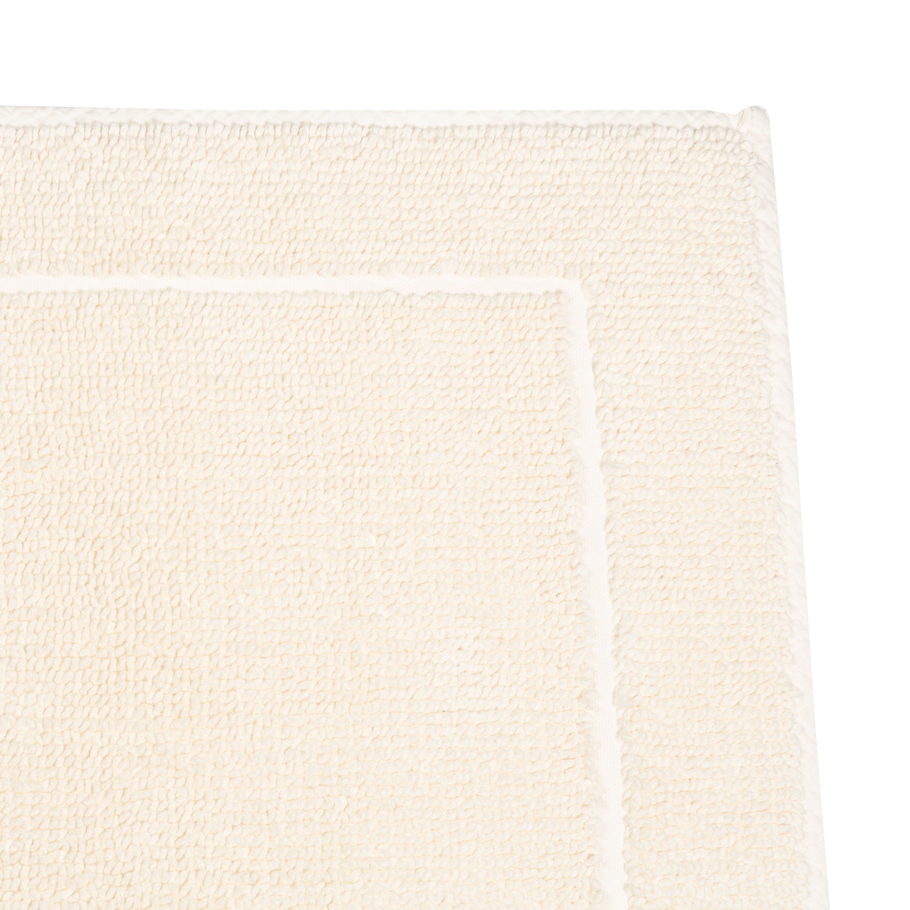 Crafted in a century-old mill in Portugal, this 100% cotton bath rug is fully reversible.