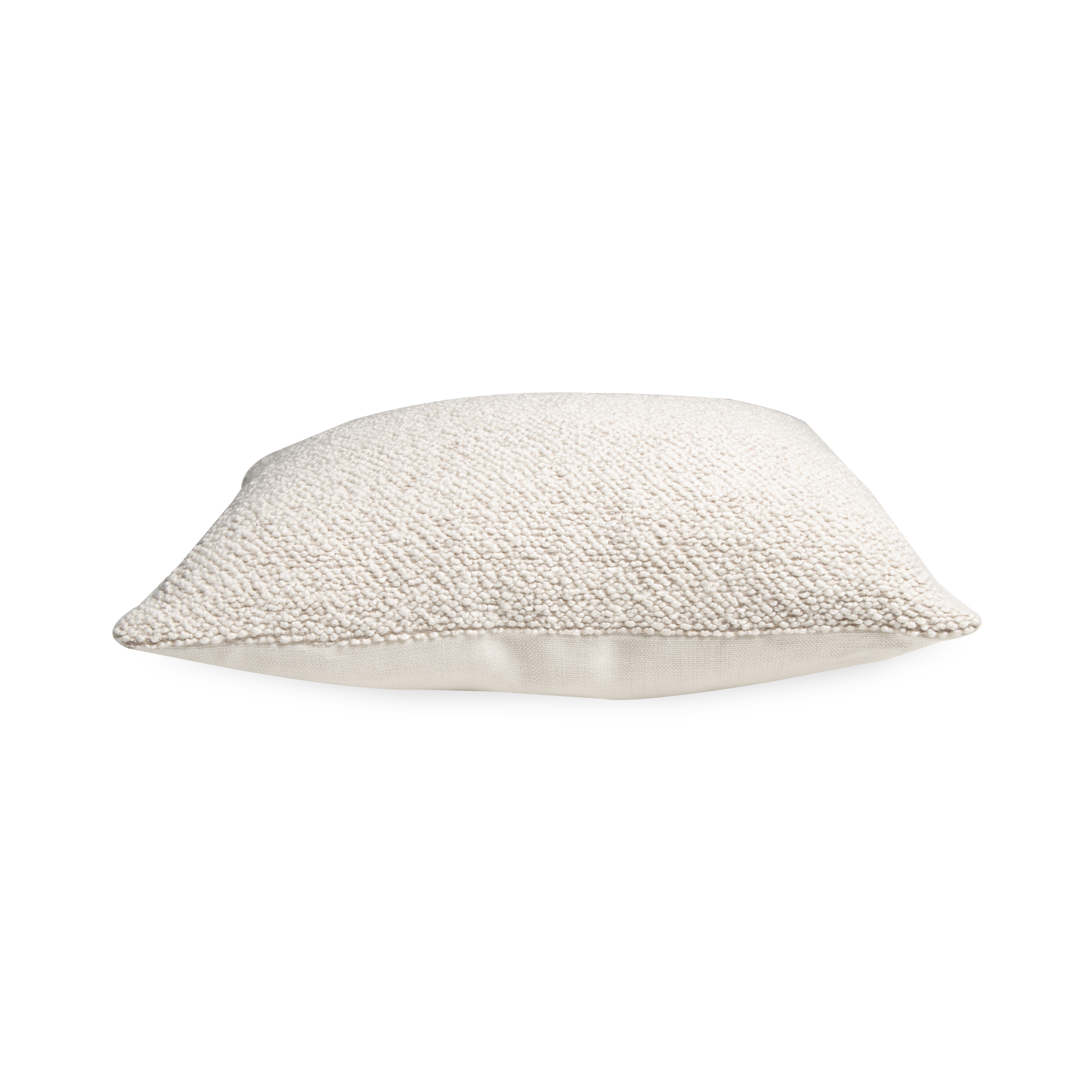 The Tasmin pillow features a plush texture and monocromatic palette.