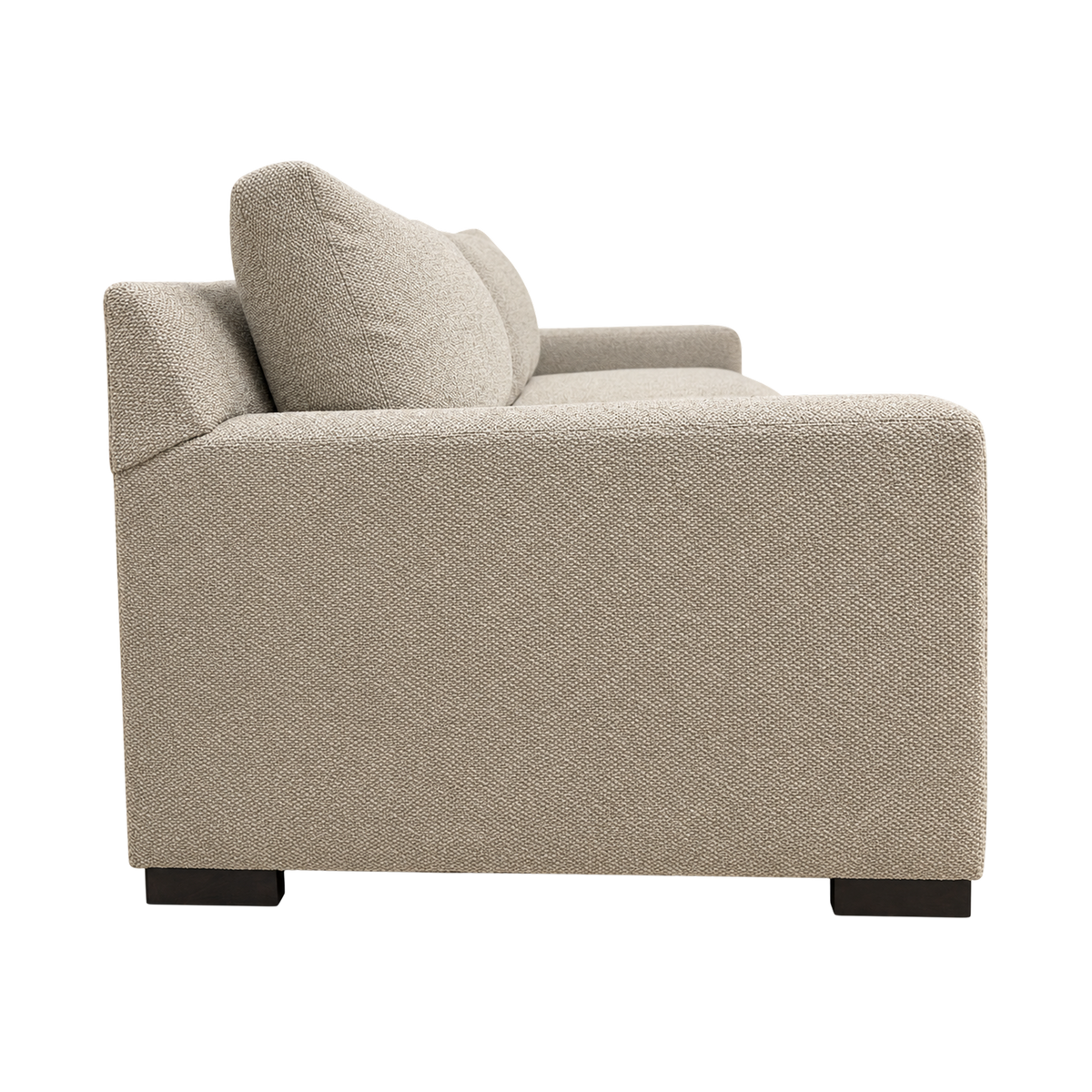 Solano Sofa in heathered taupe woven fabric, side view showing the deep, flat-topped track arm, back cushions leaning back and dark block feet.