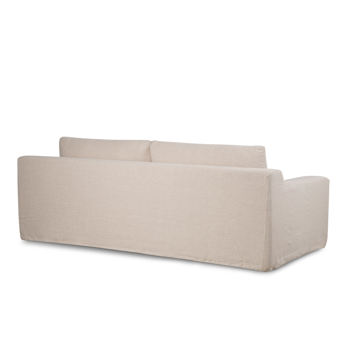 Babylon Sofa from the back corner in natural linen, showing the fully slipcovered back and arm with a clean seam.