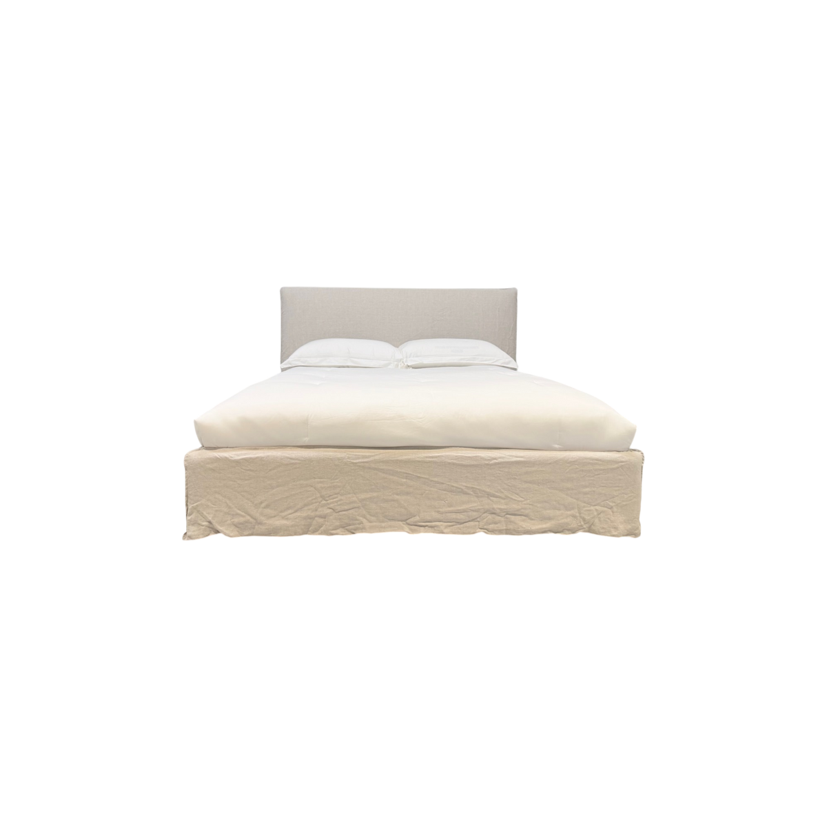 Muse Queen Bed in natural linen, front view with a clean upholstered headboard, white bedding, and a relaxed floor-length slipcover skirt.
