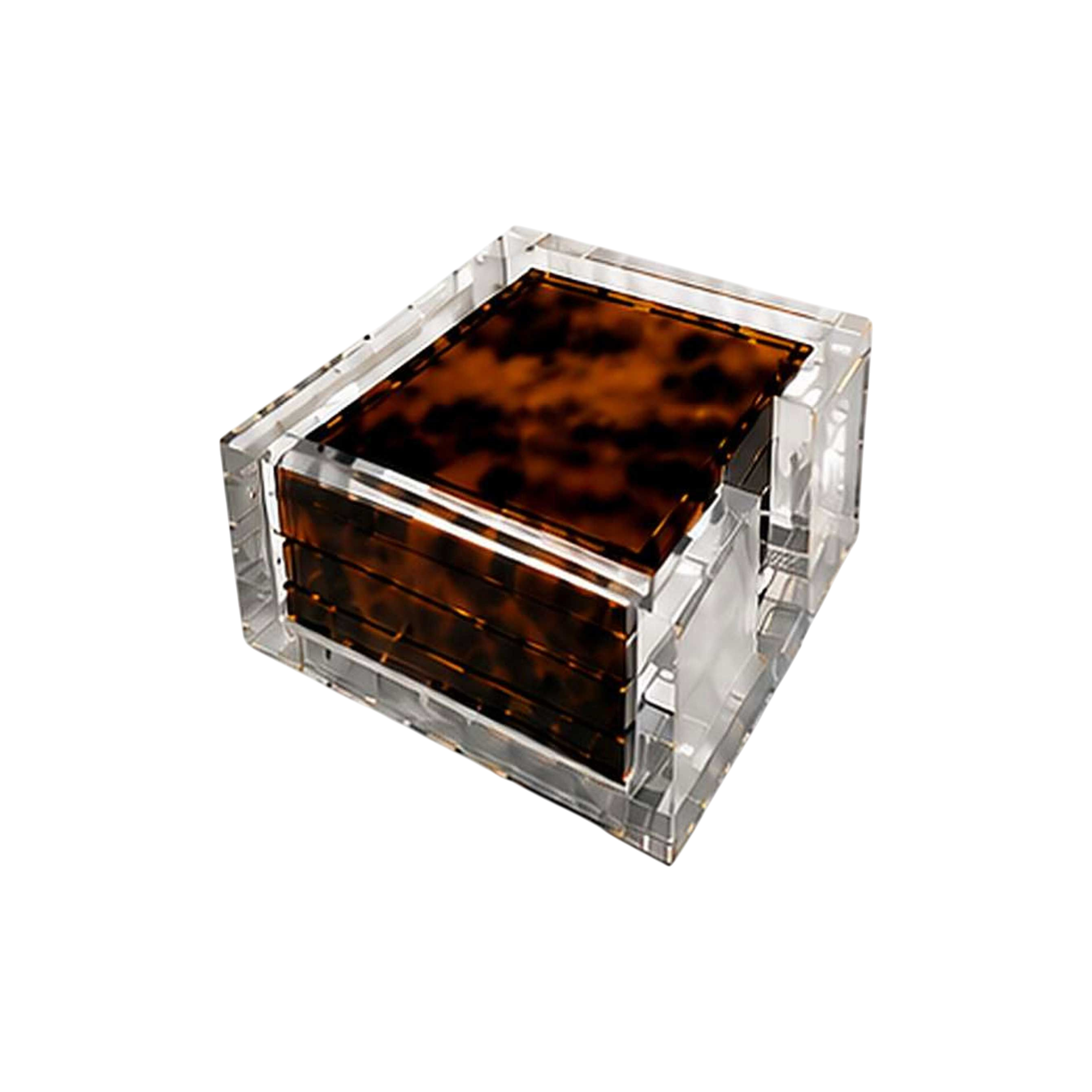 Set of four tortoiseshell-patterned acrylic coasters stacked inside a clear square Lucite holder with polished transparent edges.