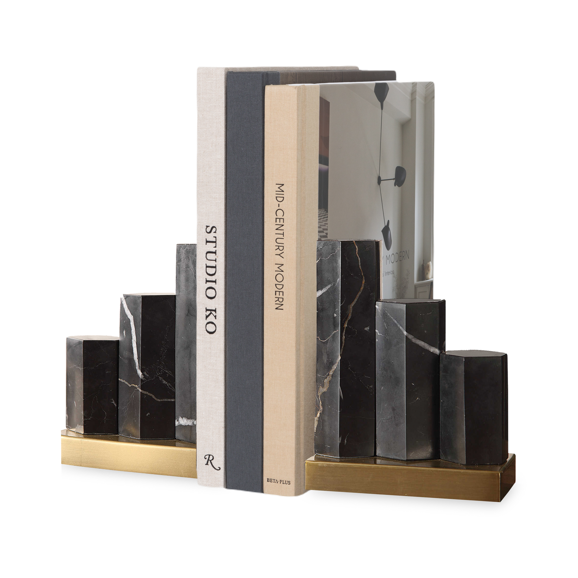 The Staggered Marble Bookends feature a staircase effect with staggered hexagonal marble pillars mounted on a sturdy brass base.