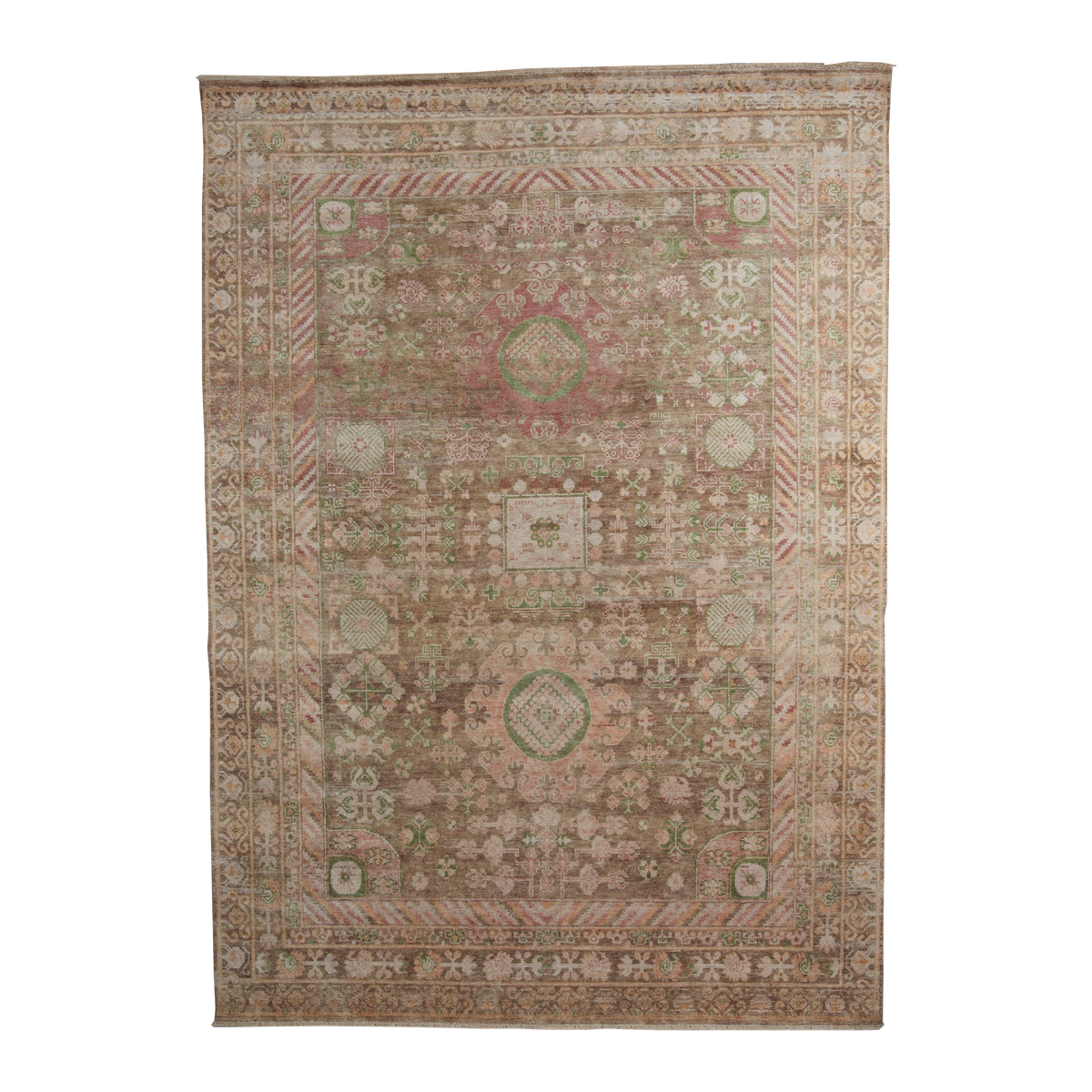 A rectangular vintage-style area rug with an intricate traditional pattern in muted tones of dusty pink, sage green, beige, and brown, shown flat against a solid white background.