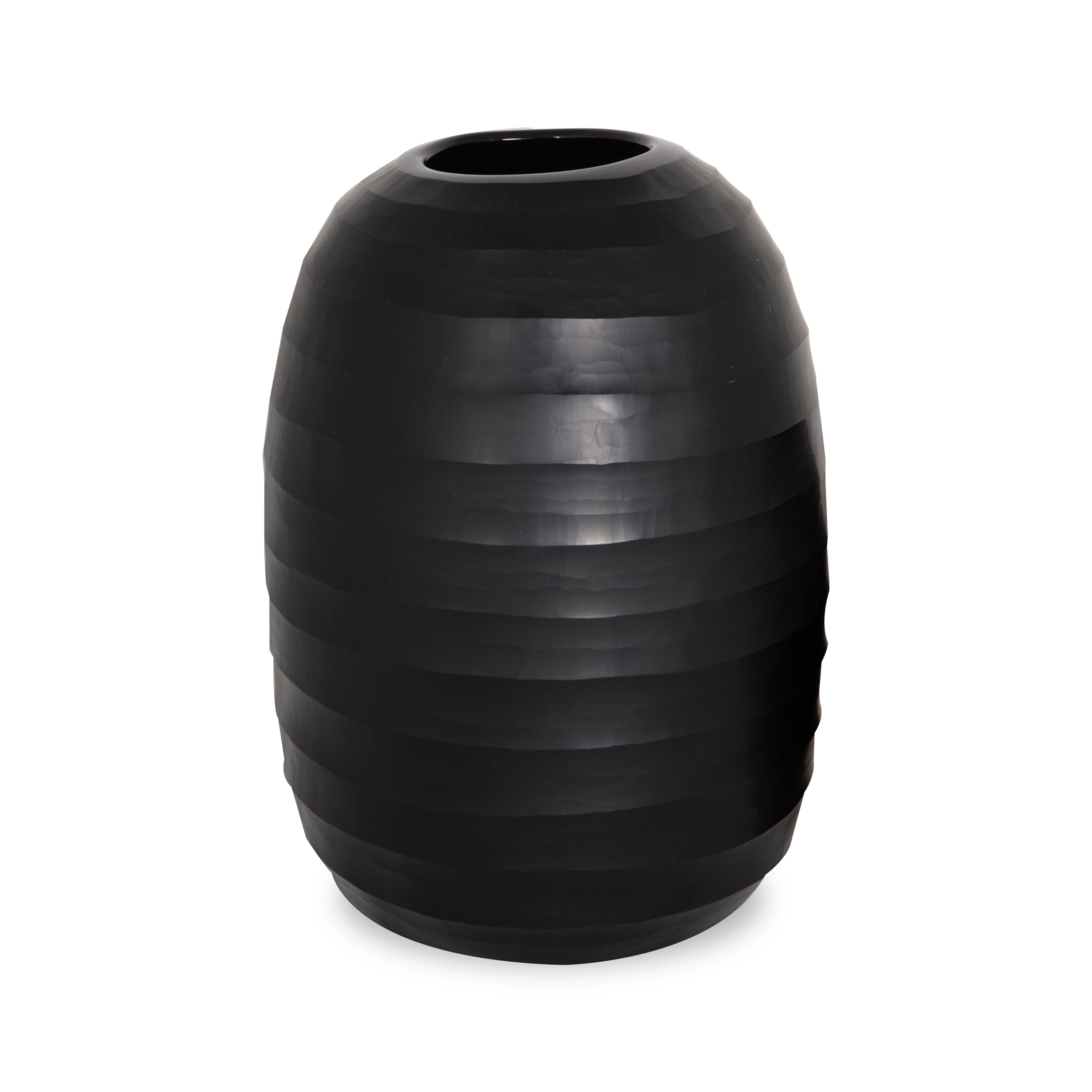 Drawing inspiration from forms of nature and cultural artifacts, the Carved Glass Vase is made from mouthblown, sustainable glass materials.