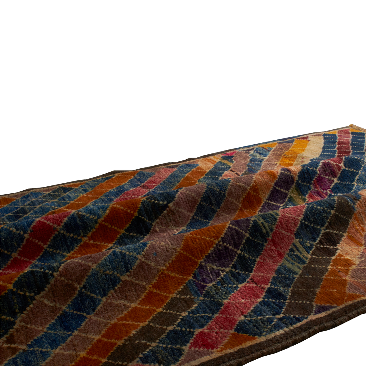 A close-up of a textured area rug with a multicolor geometric pattern of diagonal stripes in blue, orange, red, brown, and beige, shown against a plain white background.