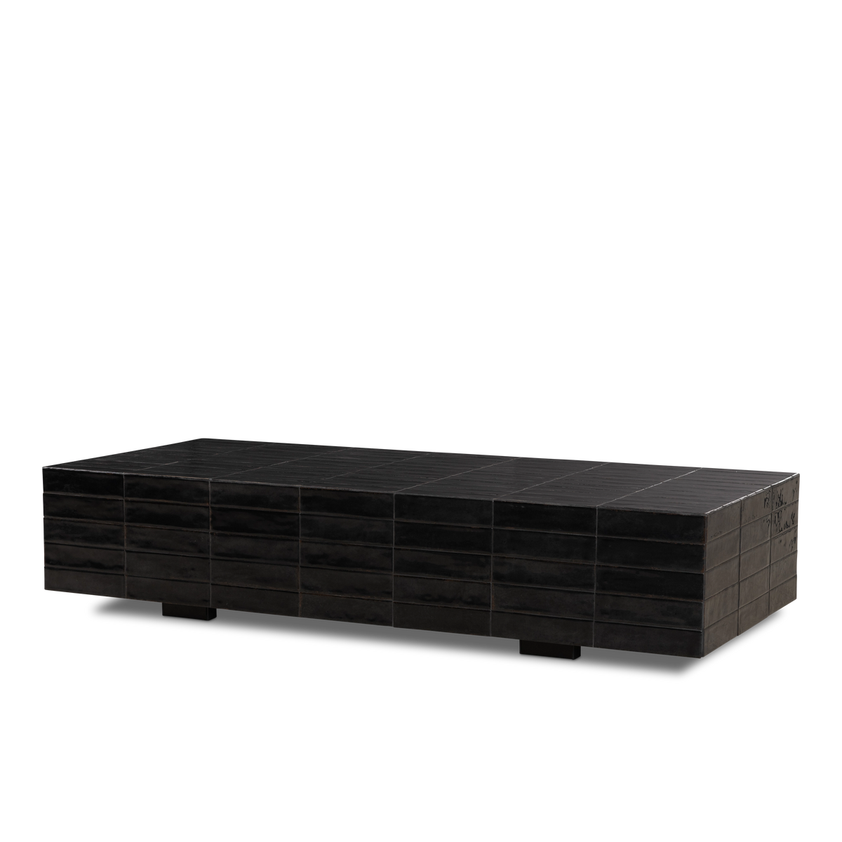 Bloor Coffee Table angled view in Black glazed tile, showing the tiled top, the staggered tile pattern on the long side, and glossy glaze pooling at the end edge.
