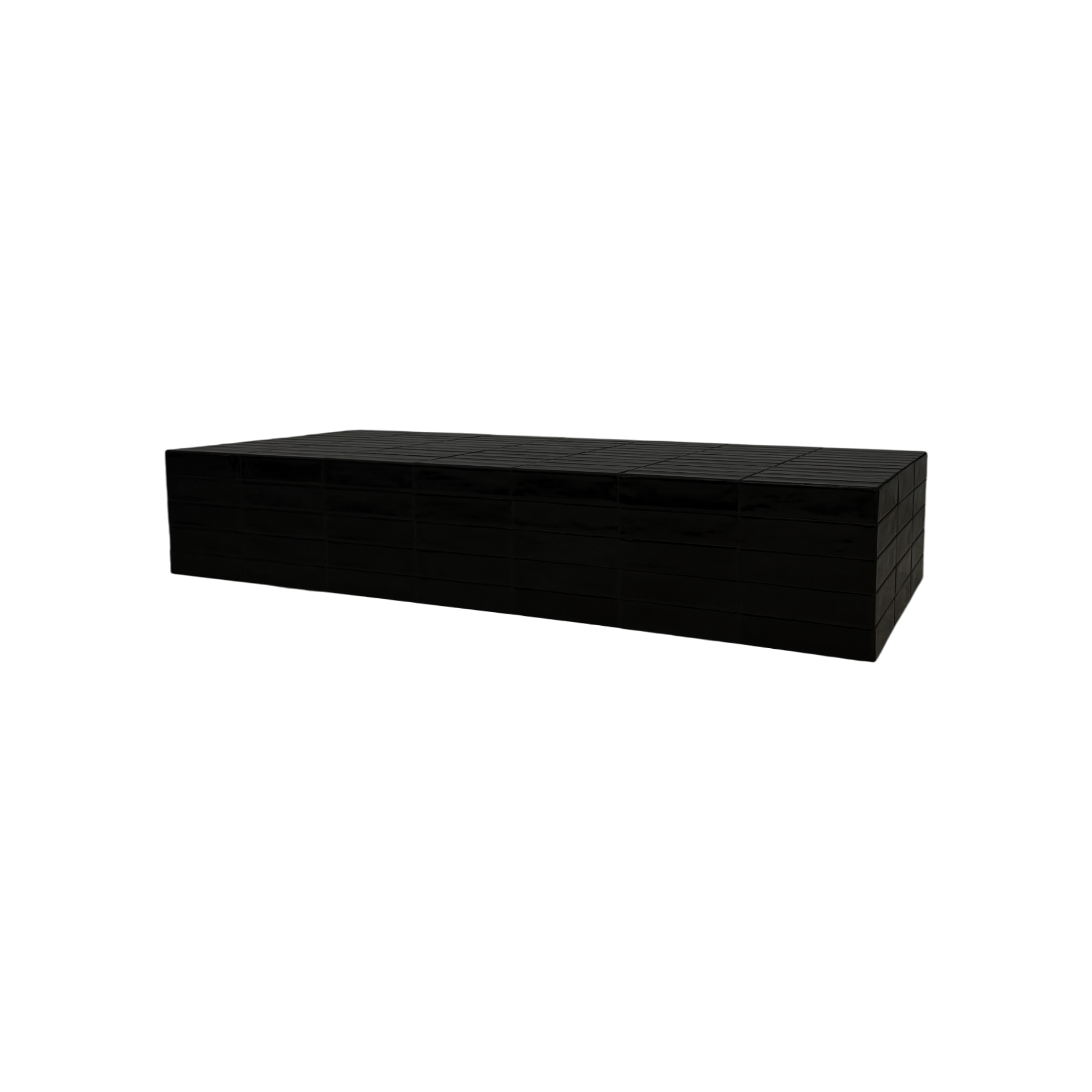 Bloom Coffee table is a long, low black table shown at an angle on a plain white background.