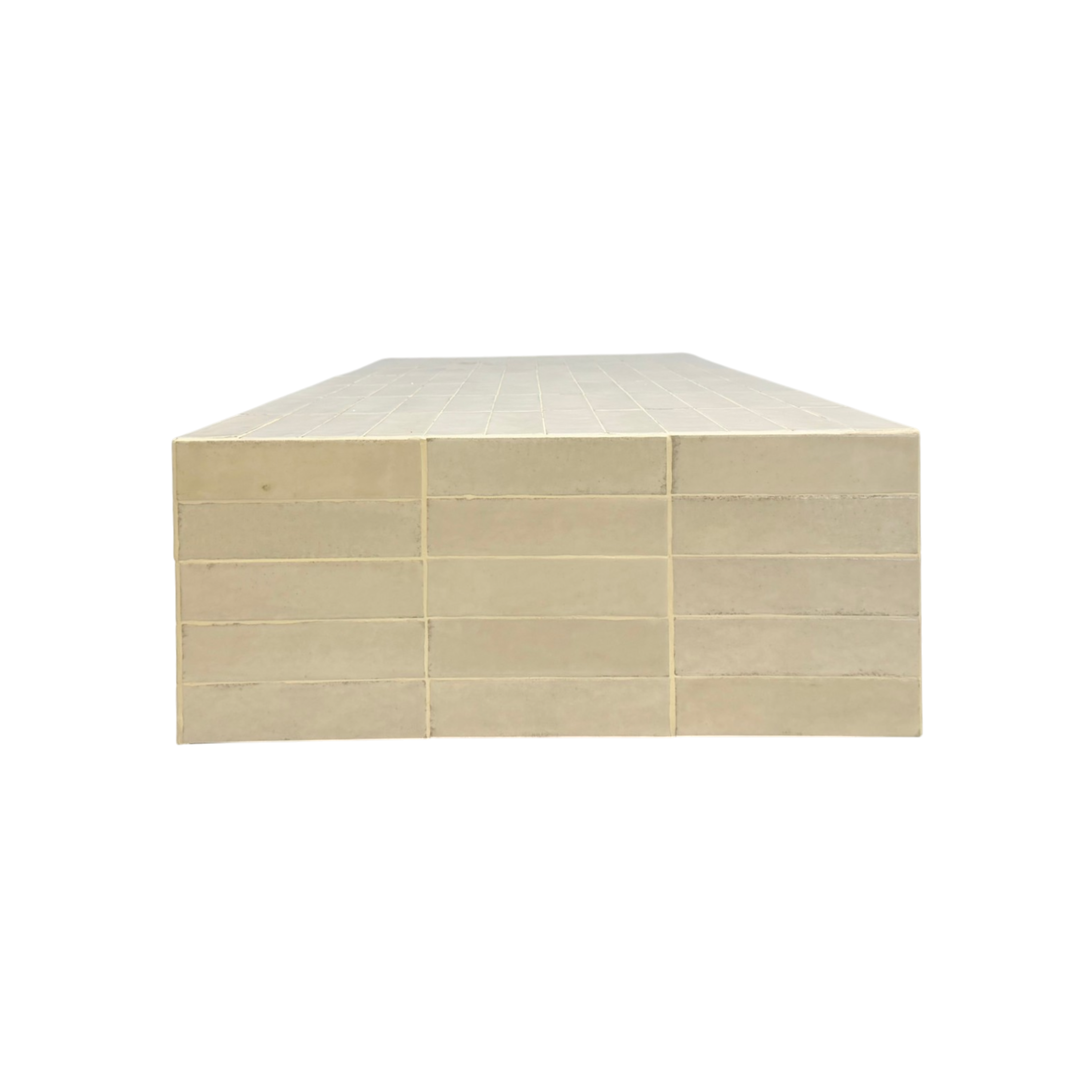 A stack of rectangular ceramic or stone tiles in a light beige or cream color, arranged in a grid pattern, shown against a plain white background.