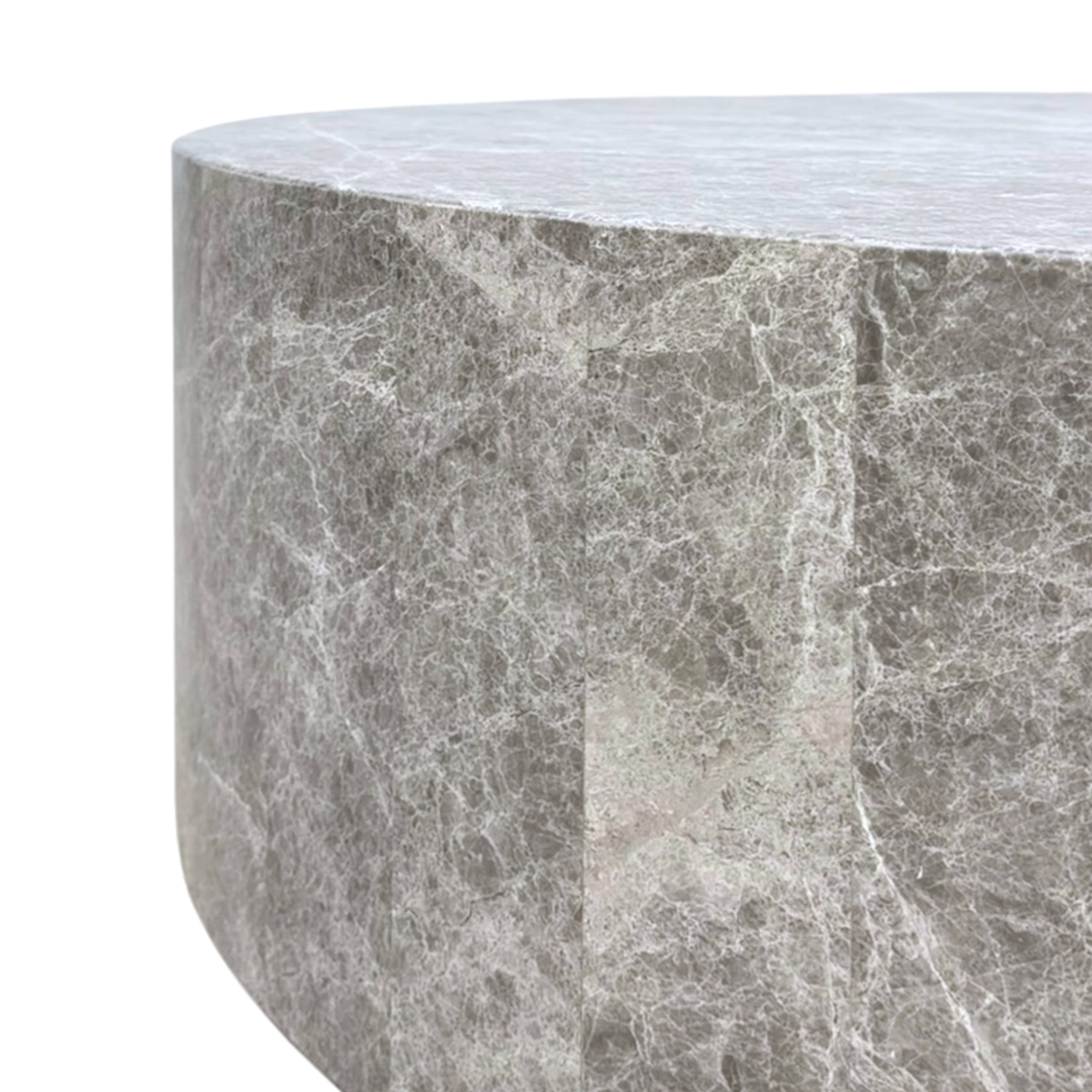 Close-up of the Ward Coffee Table, showing its rounded edge, patchwork stone panels and intricate white veining across the grey surface.