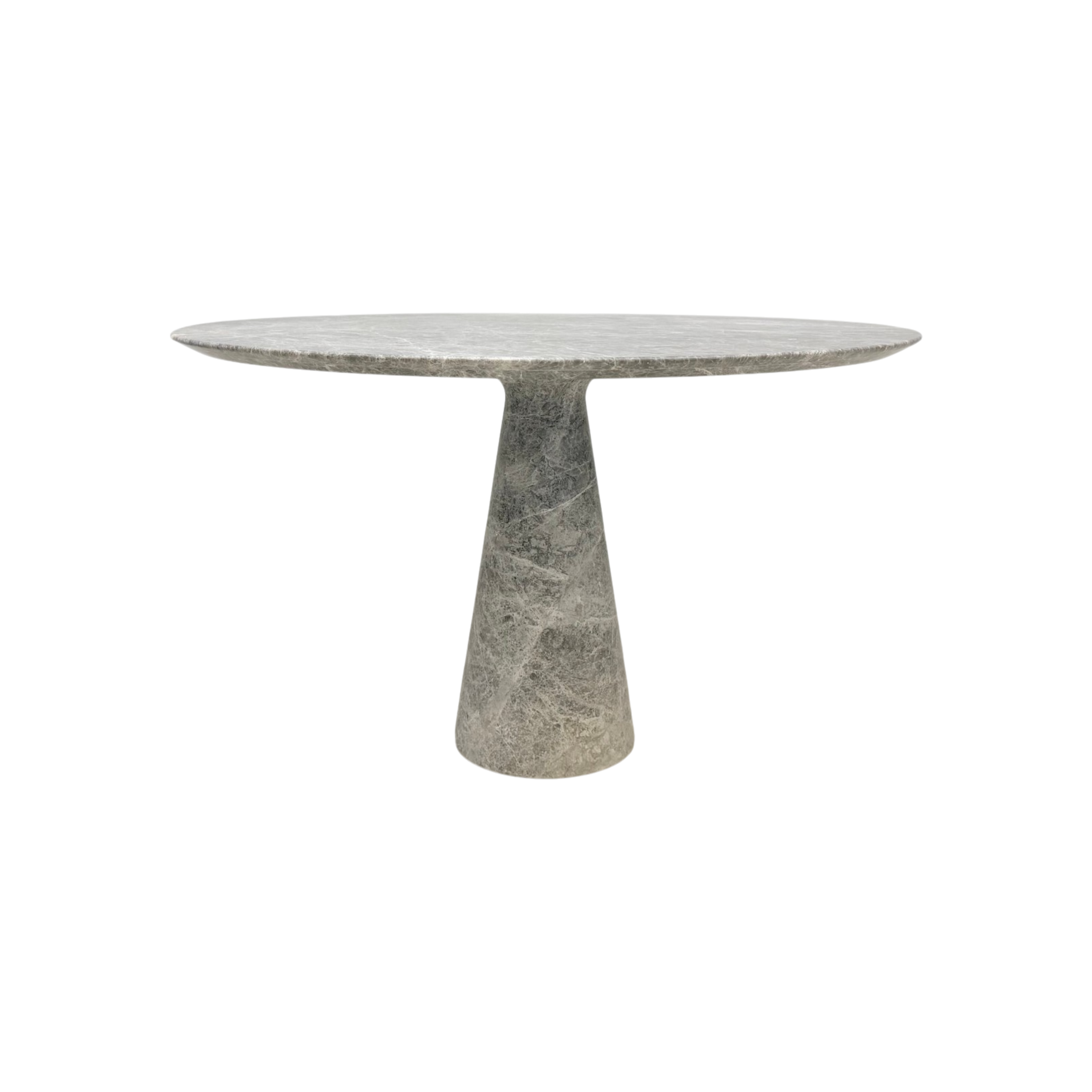 Close-up of the soho dining table, highlighting the thin rounded tabletop edge, tapered pedestal base and natural veining