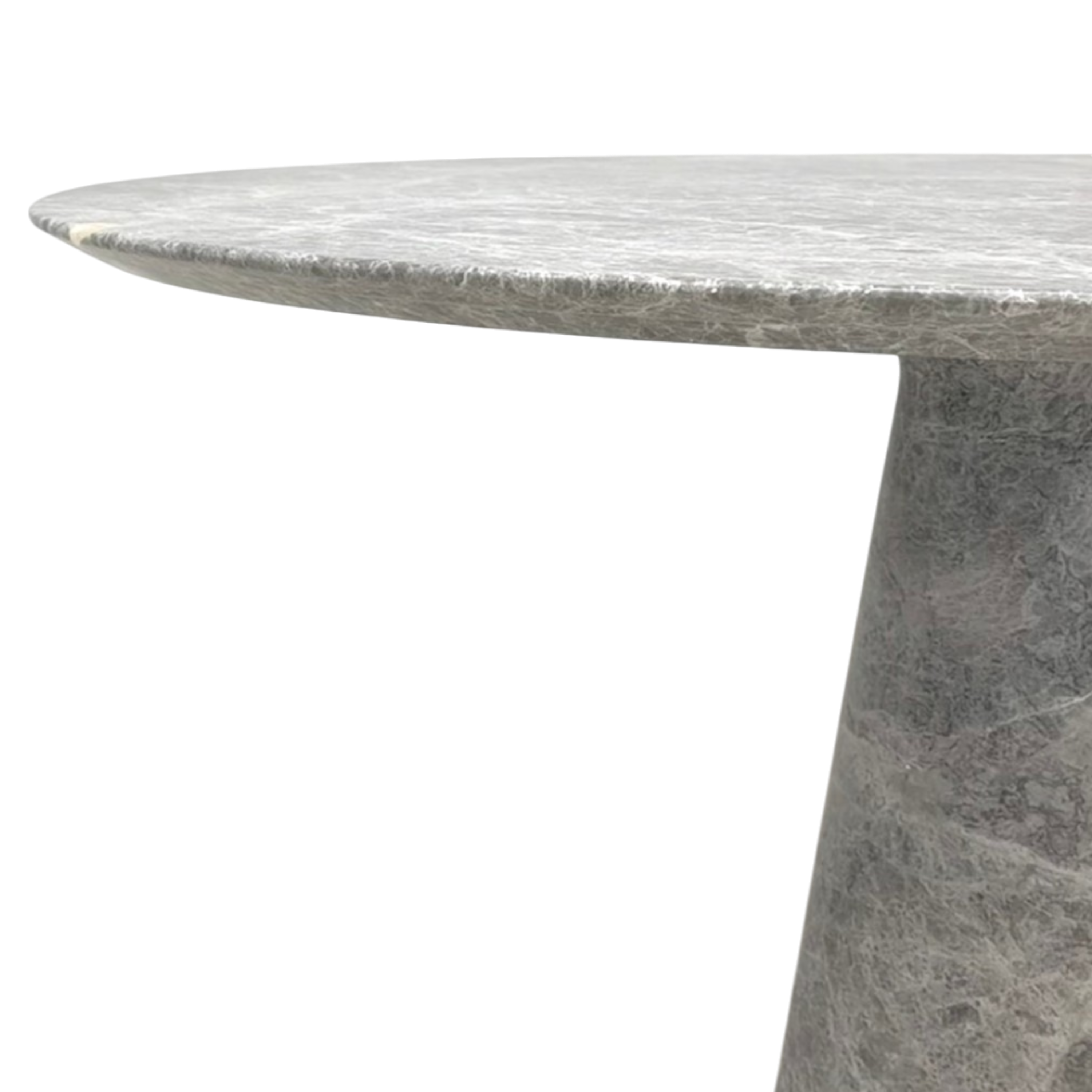 Close-up of the grey Soho stone dining table, highlighting the thin rounded tabletop edge, tapered pedestal base and natural veining
