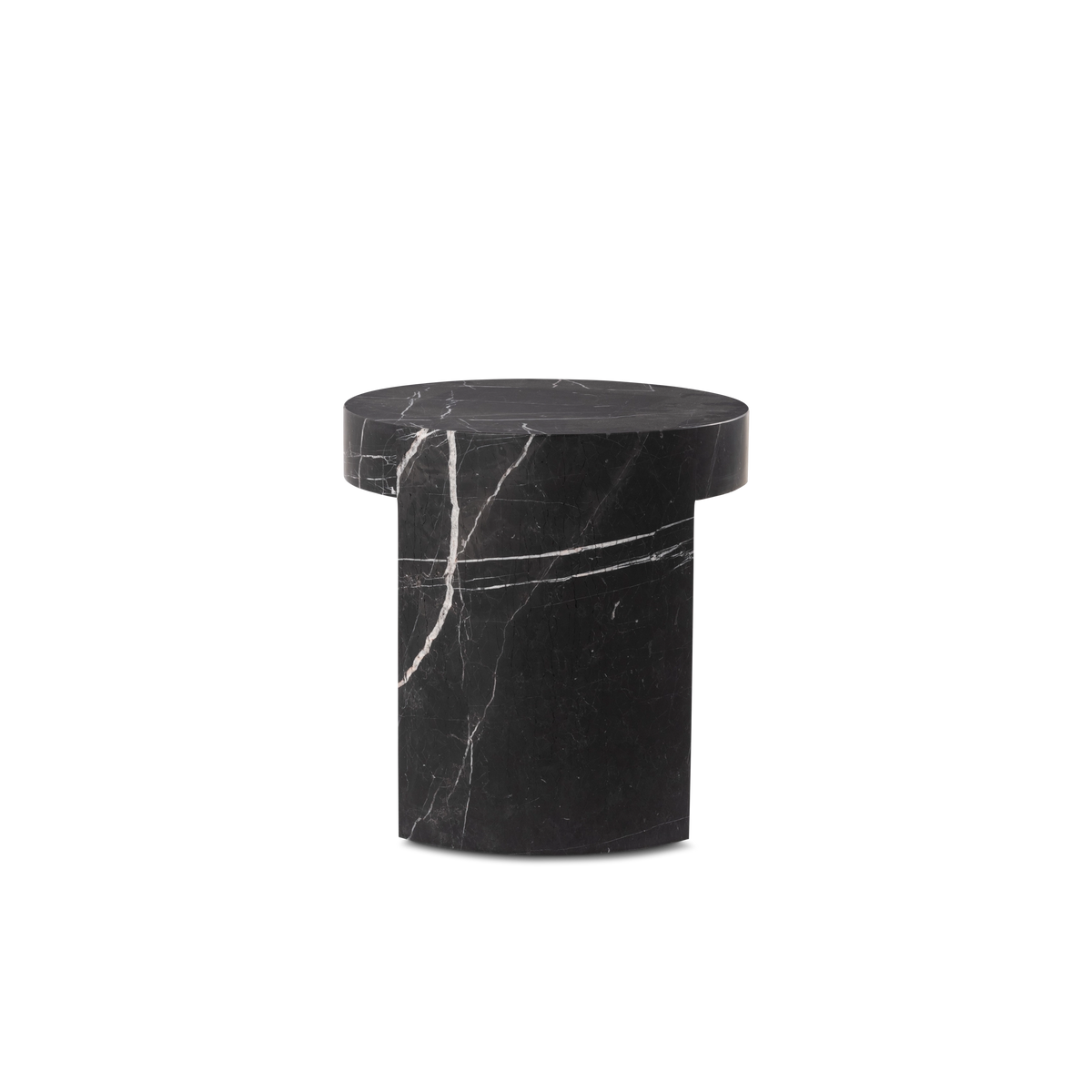Shift Side Table in Black Nero Marquina marble from the side, showing the solid curved leg beneath the overhanging round top and a long horizontal white vein.