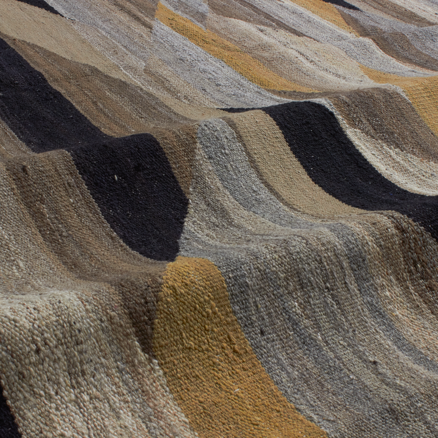 Revered for its luster and soft hand, the natural qualities of wool from ancient Karakul sheep are honored through restraint and refinement.