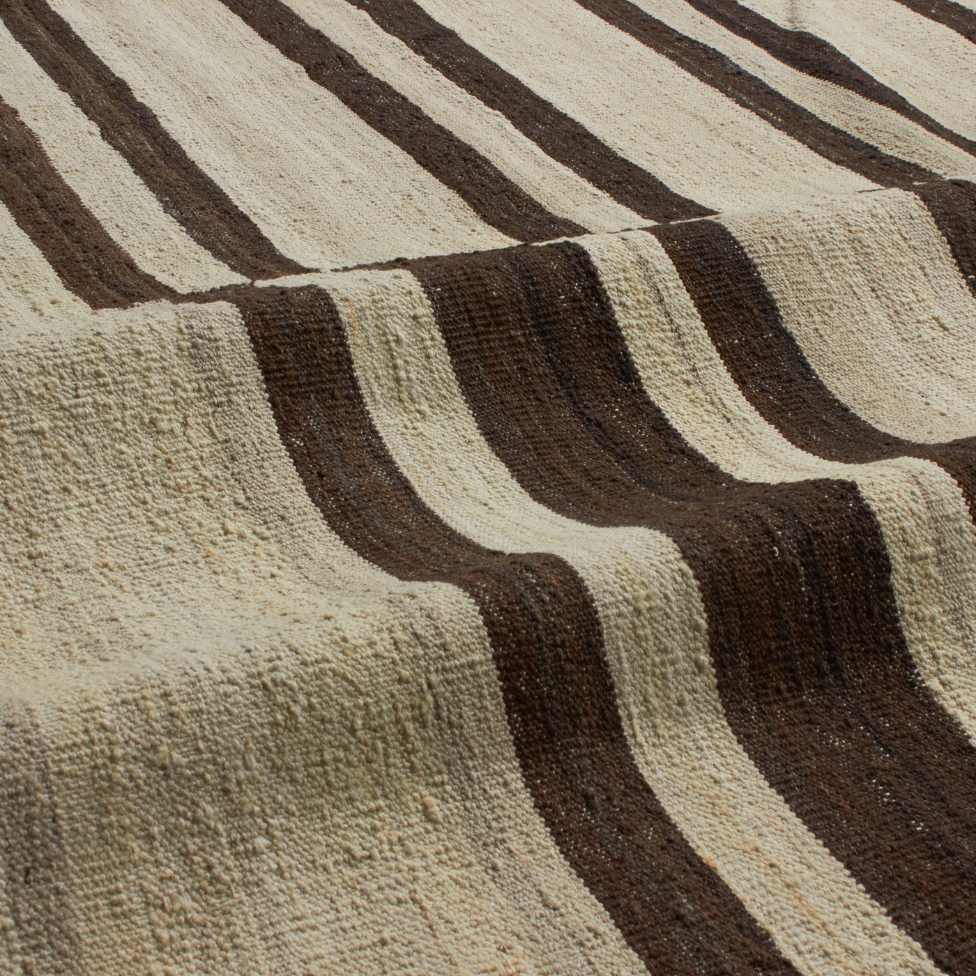 Revered for its lustre and soft hand, the natural qualities of wool from ancient Karakul sheep are honoured through restraint and refinement.