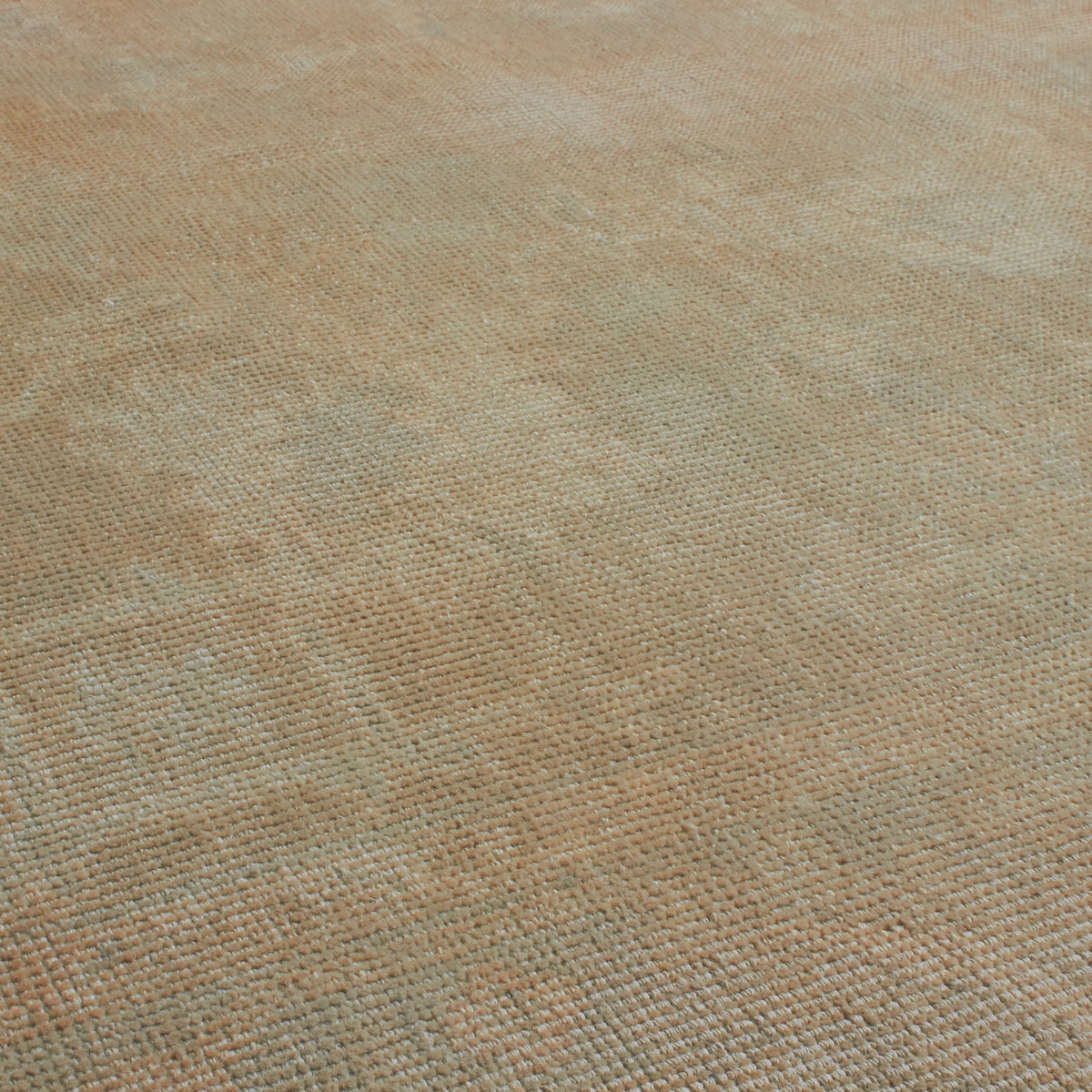 A close-up of a woven fabric texture in a warm beige and light brown color, showing the detailed weave pattern.