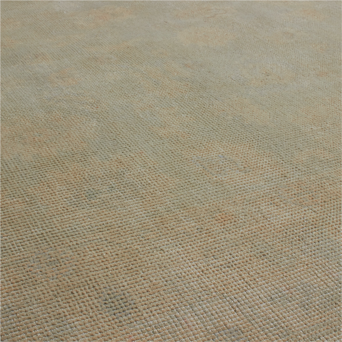 A close-up of a woven fabric texture with a subtle distressed pattern in muted beige, gray, and light brown tones.