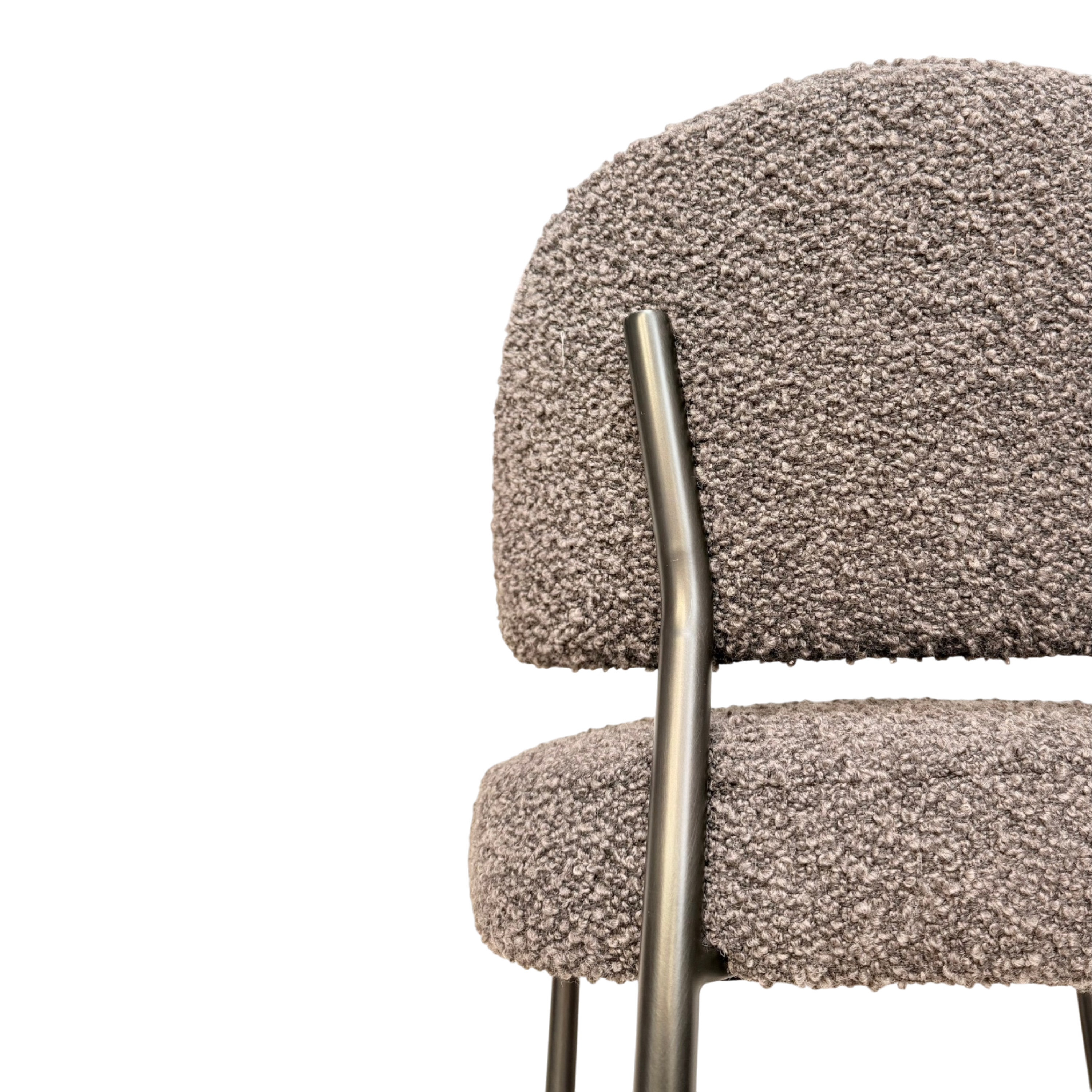 Close-up of a modern upholstered chair with a textured bouclé seat and back in taupe-gray, supported by a brushed metal frame, shown against a solid white background.