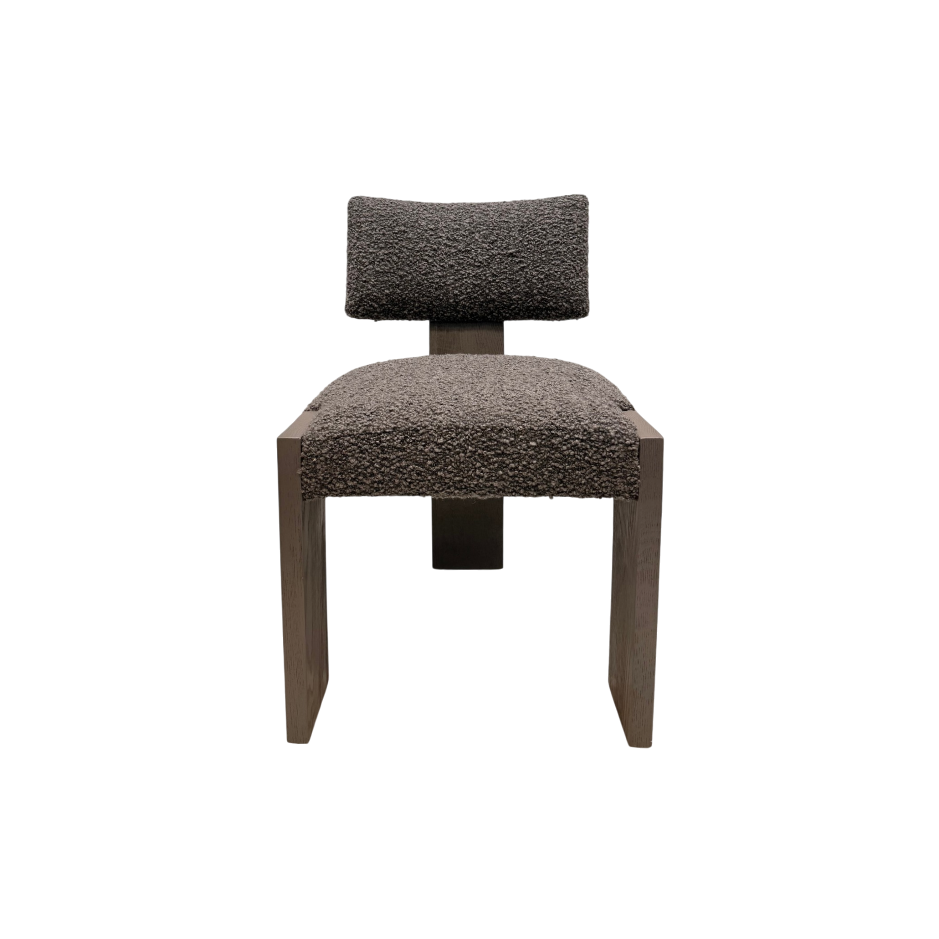 A modern accent chair with a textured, bouclé-look upholstered seat and backrest, supported by a dark wood frame, shown against a plain white background.