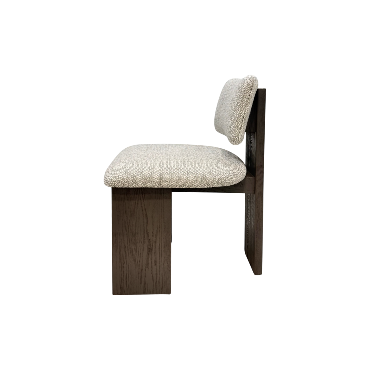 Giussano Dining Chair side view showing the softly rounded ivory bouclé seat and back cushion against the clean-lined dark wood structure.
