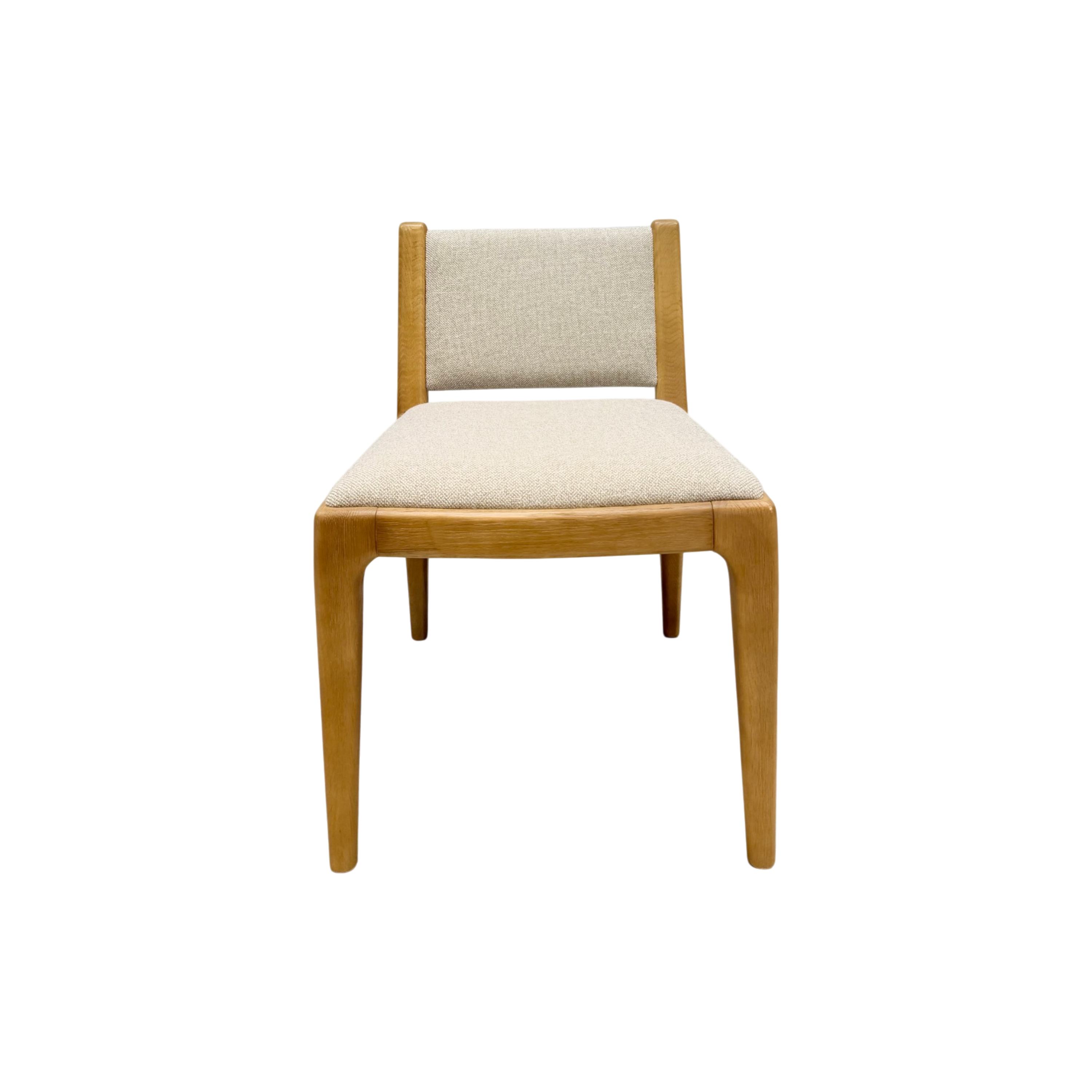 A mid-century modern dining chair with a light oak wood frame and beige textured fabric upholstery on the seat and backrest, shown from a front-facing perspective on a solid white background.