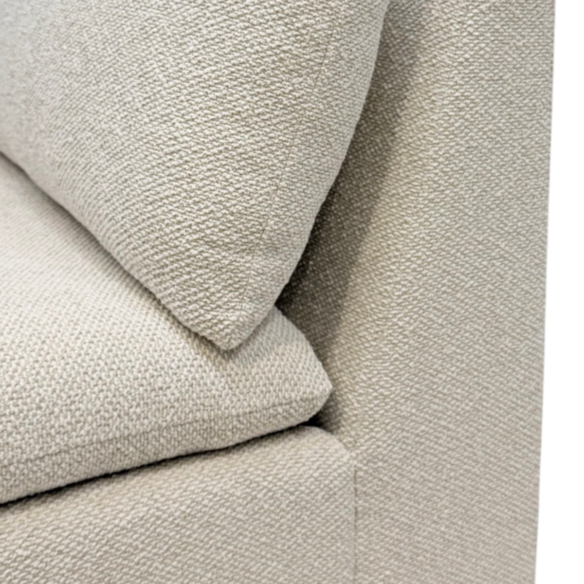 Tempo Modular Armless Chair close-up showing the textured ivory upholstery and layered loose seat and back cushions.