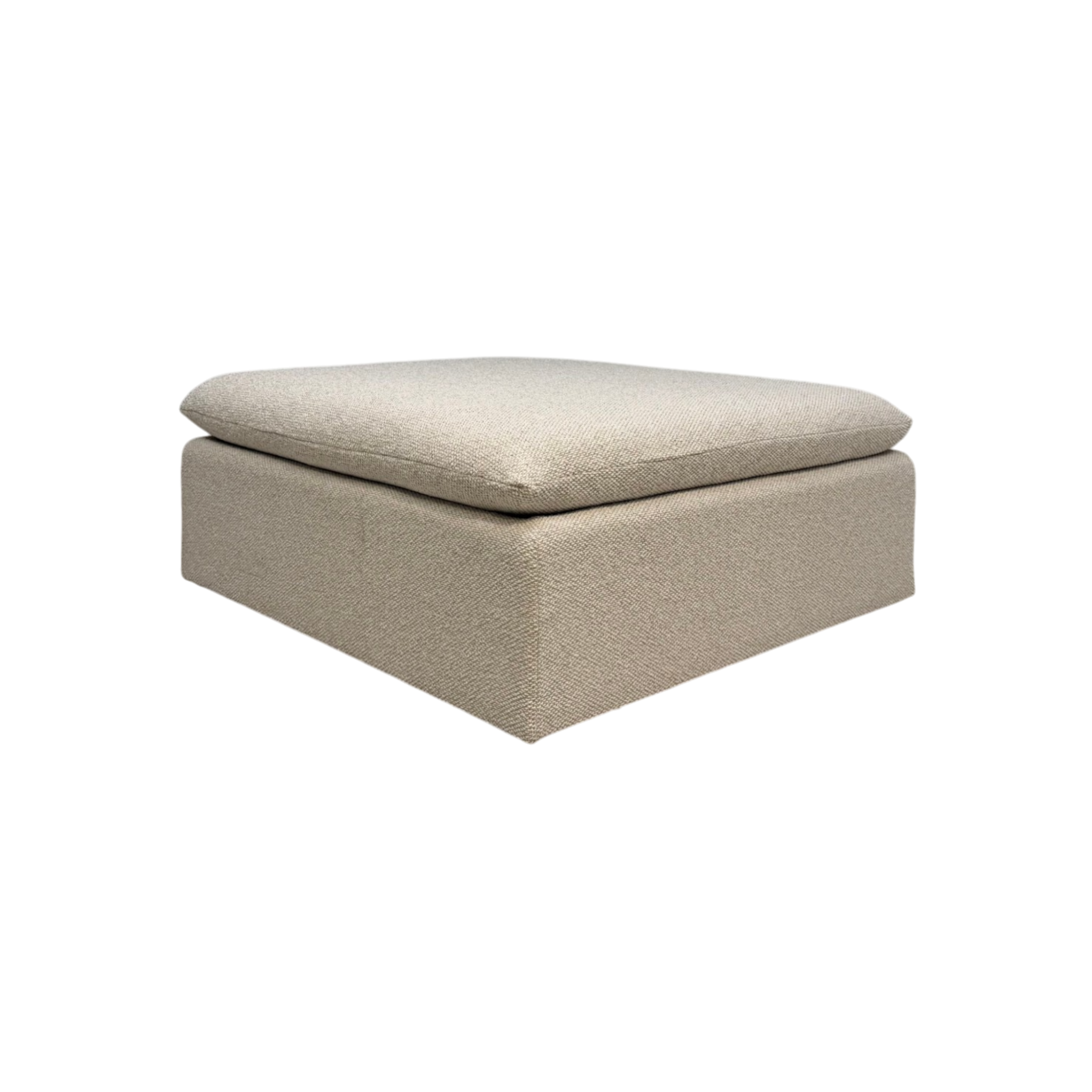 Tempo Modular Ottoman in an angled view with ivory textured upholstery, a low-profile rectangular base, and an oversized loose cushion.