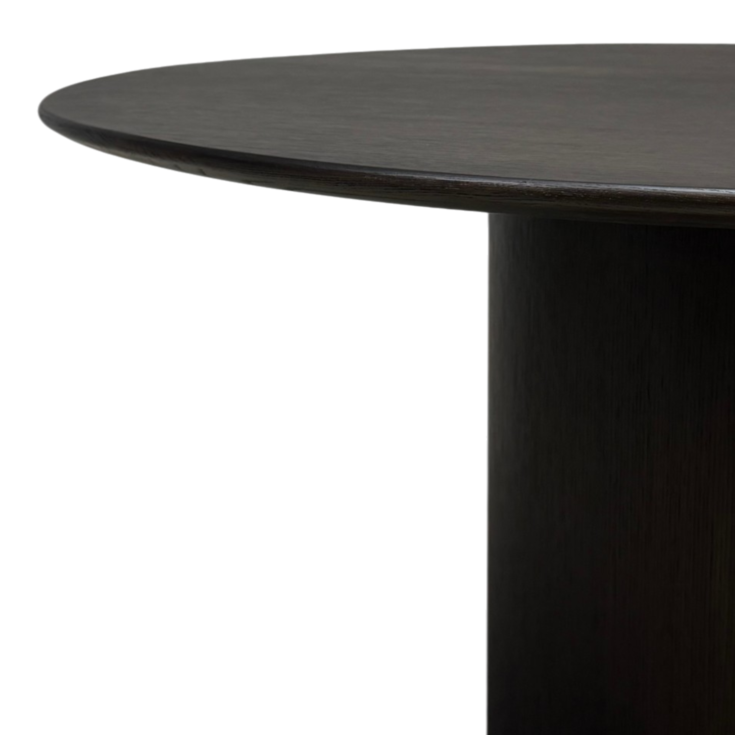 Close-up of Altar Round Dining Table showing softly rounded tabletop edge and dark brown oak pedestal.