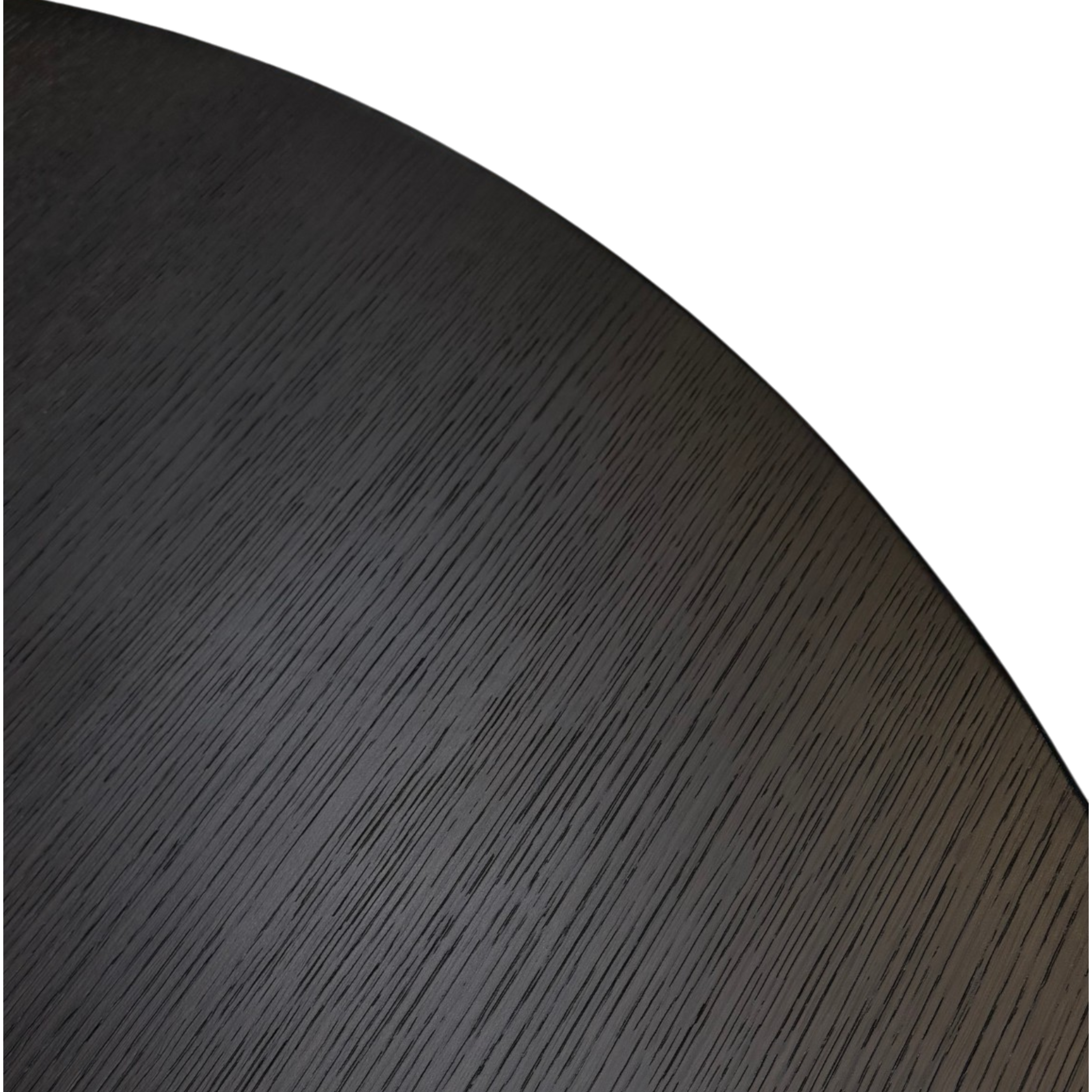 Detail of dark brown oak grain across the round tabletop of the Altar Dining Table.