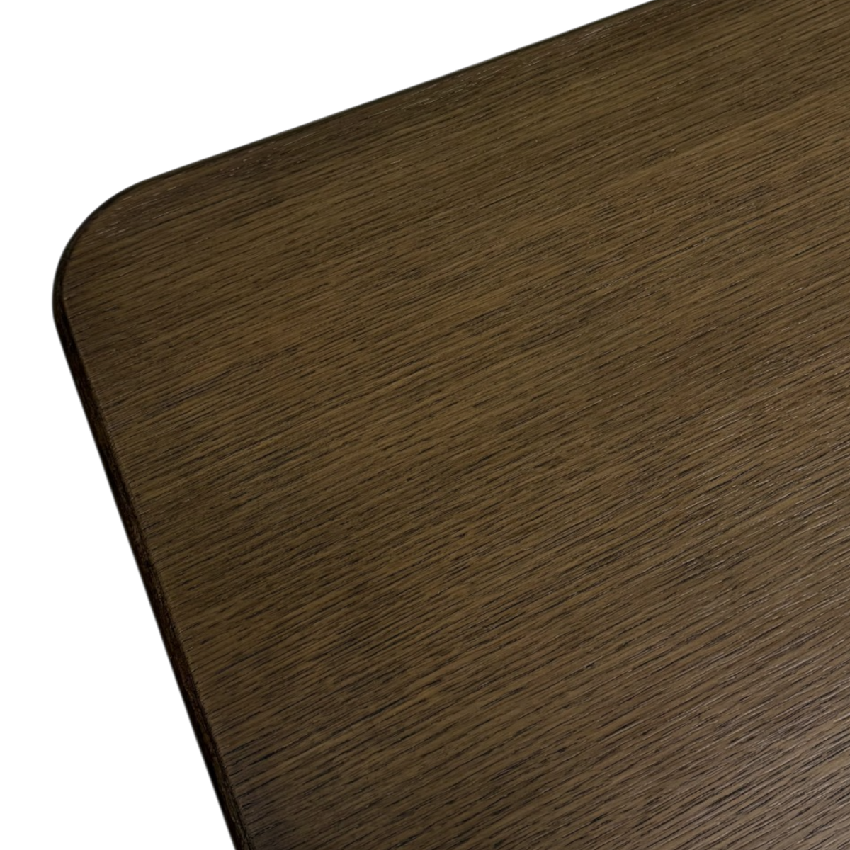 Detail view of the Altar 96-inch Dining Table highlighting the rich dark wood grain, smooth finish and gently rounded tabletop corner.