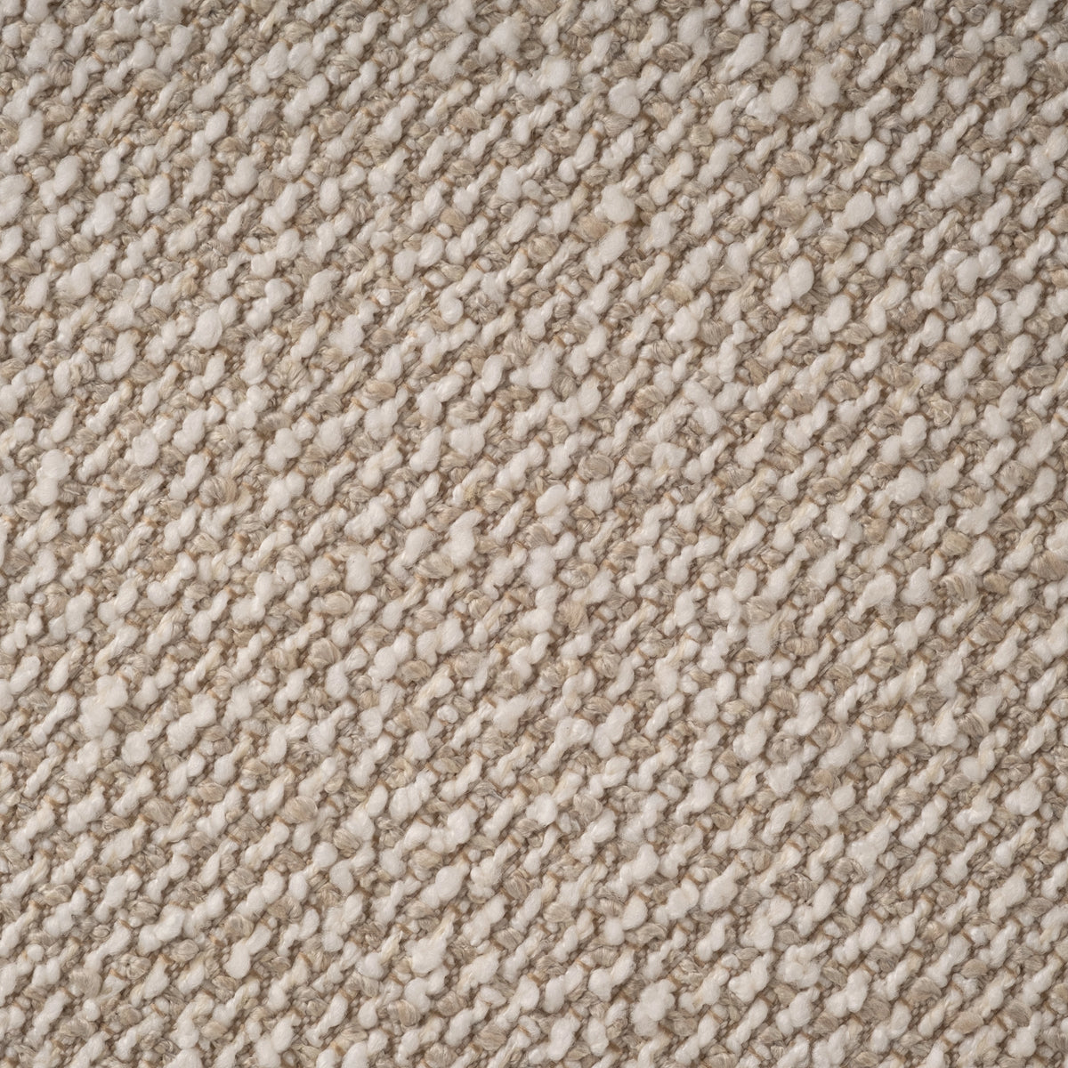 Close-up of the Knox Lounge Chair’s oatmeal fabric, showing creamy white nubs woven over sandy taupe yarns in a diagonal pattern.