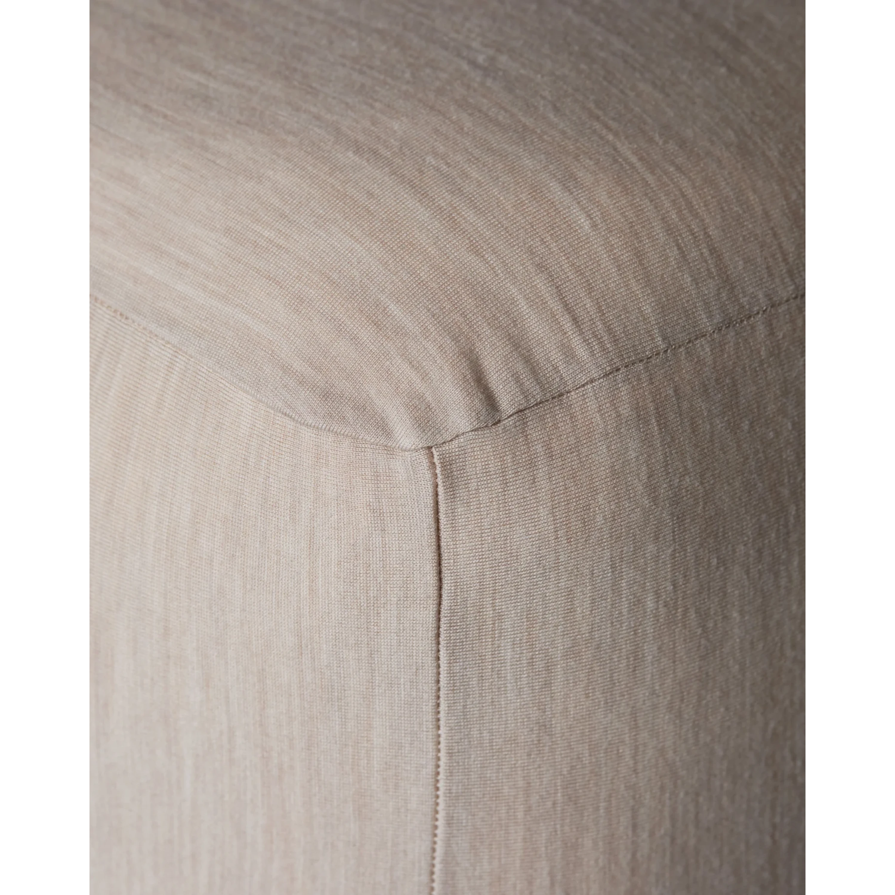Close-up of Merino Fit Sheet King in Ivory showing the smooth jersey texture, fitted corner and tailored seam detail.